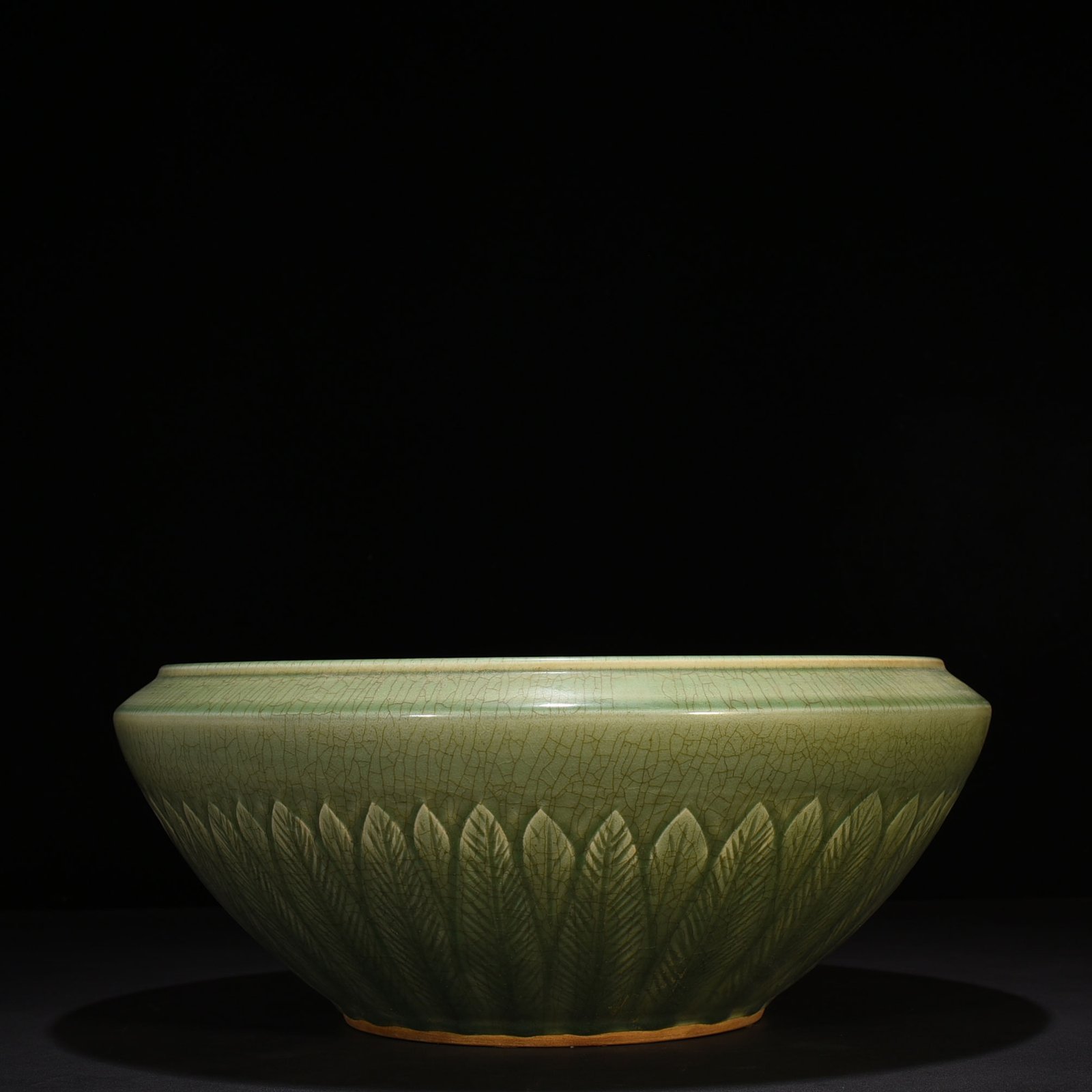 Song Dynasty Longquan kiln plum green glaze bowl with carved banana leaf pattern