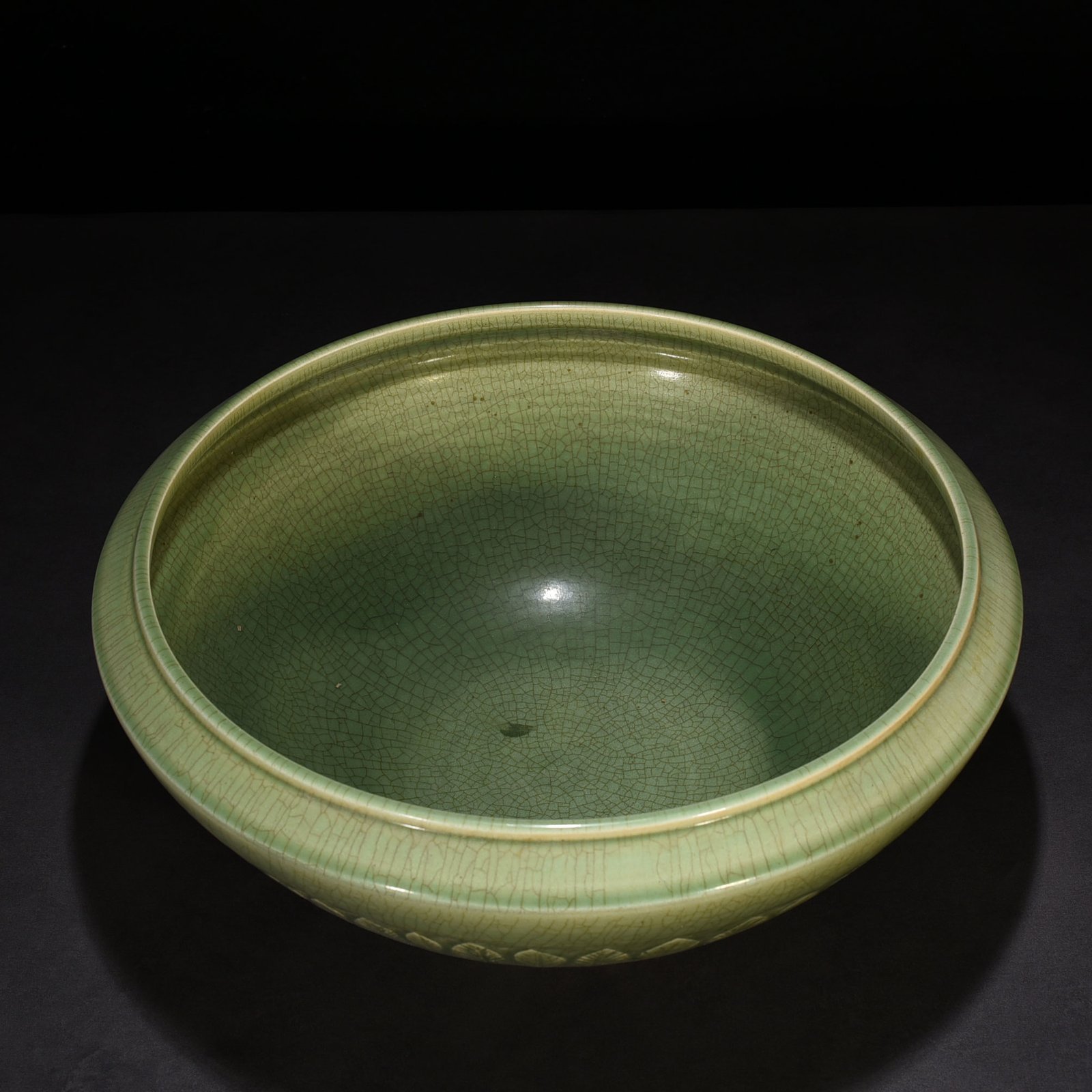 Song Dynasty Longquan kiln plum green glaze bowl with carved banana leaf pattern