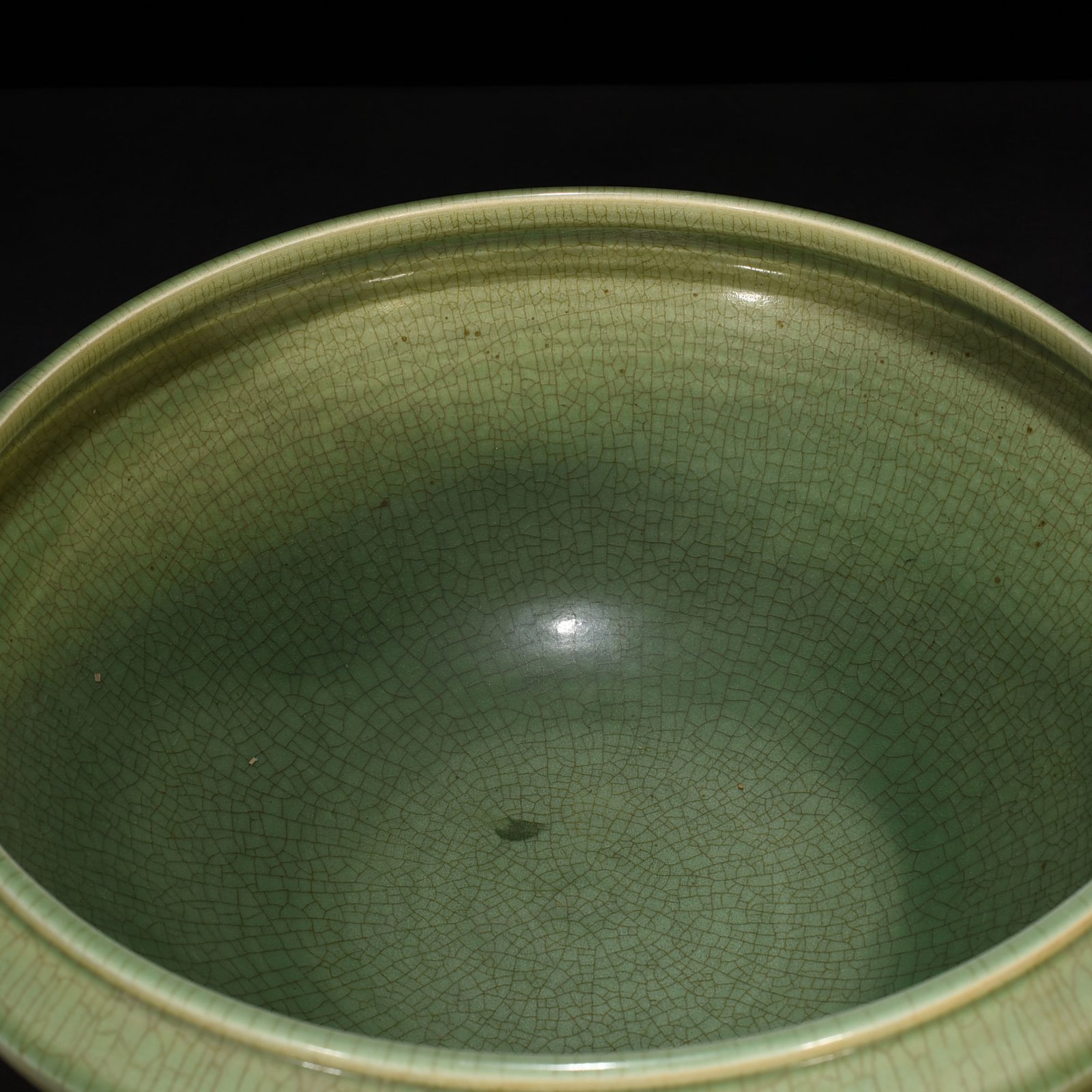 Song Dynasty Longquan kiln plum green glaze bowl with carved banana leaf pattern
