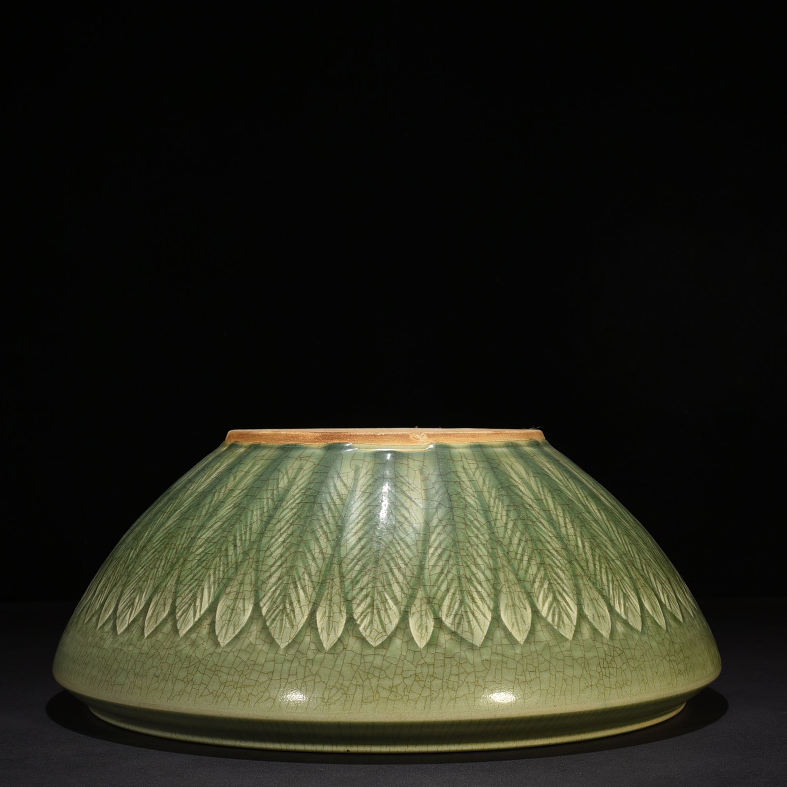 Song Dynasty Longquan kiln plum green glaze bowl with carved banana leaf pattern