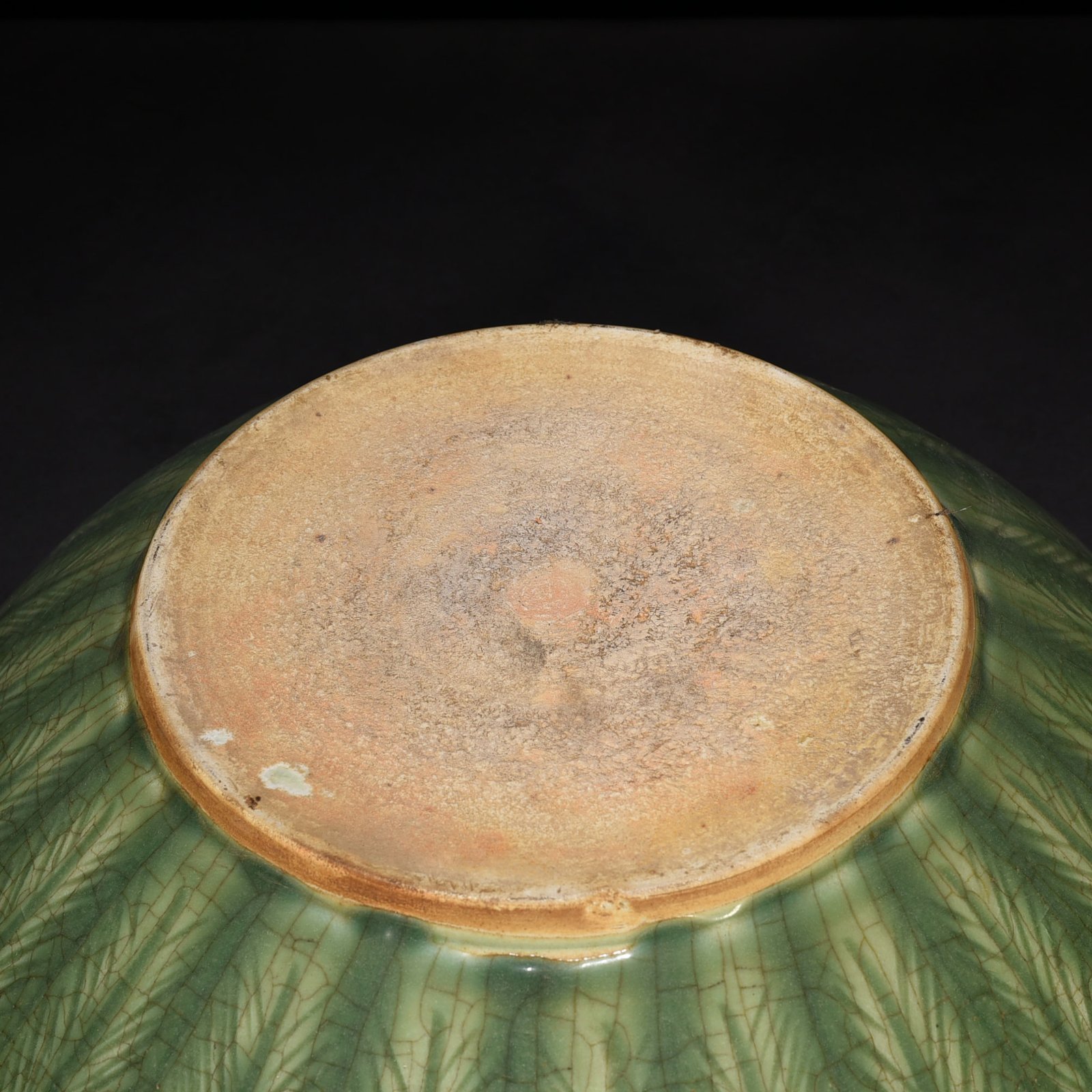 Song Dynasty Longquan kiln plum green glaze bowl with carved banana leaf pattern