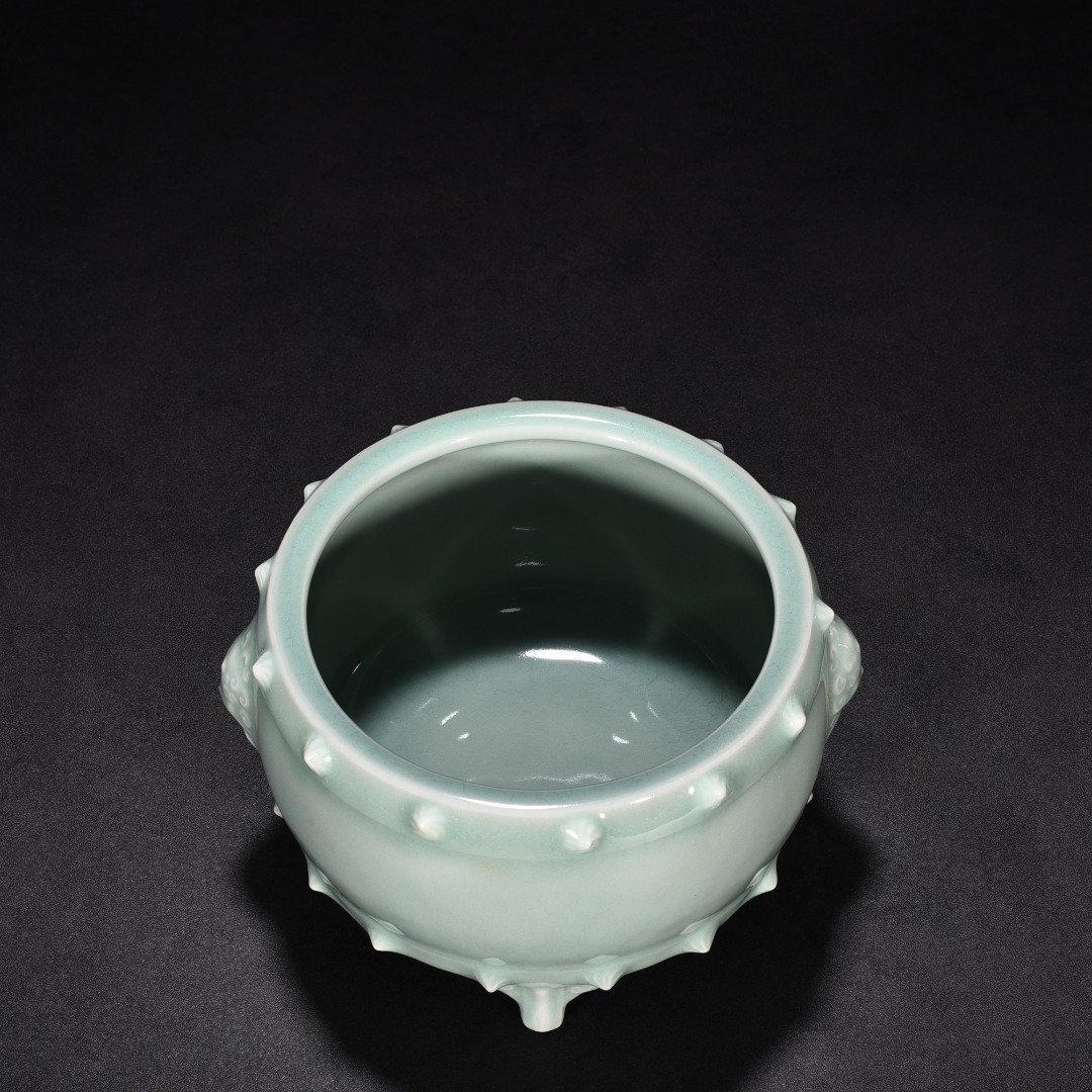Song Dynasty Longquan kiln pink celadon glaze animal ear drum nail furnace