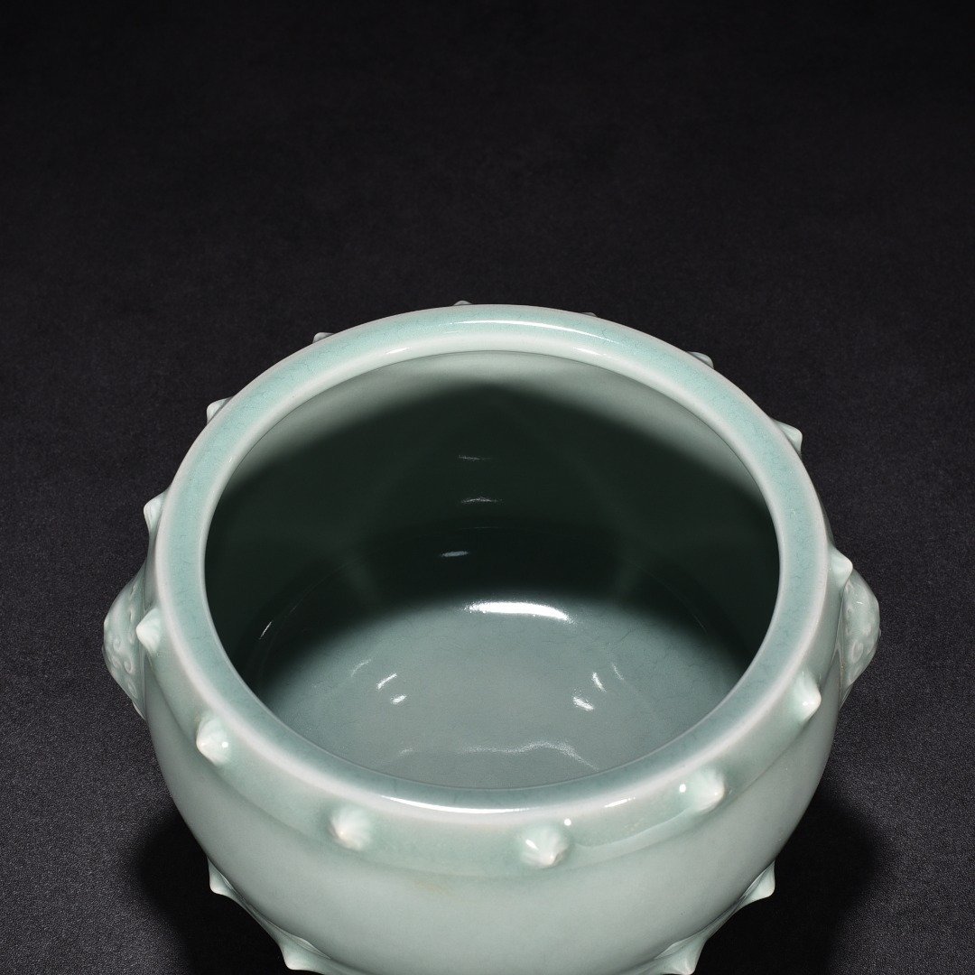 Song Dynasty Longquan kiln pink celadon glaze animal ear drum nail furnace