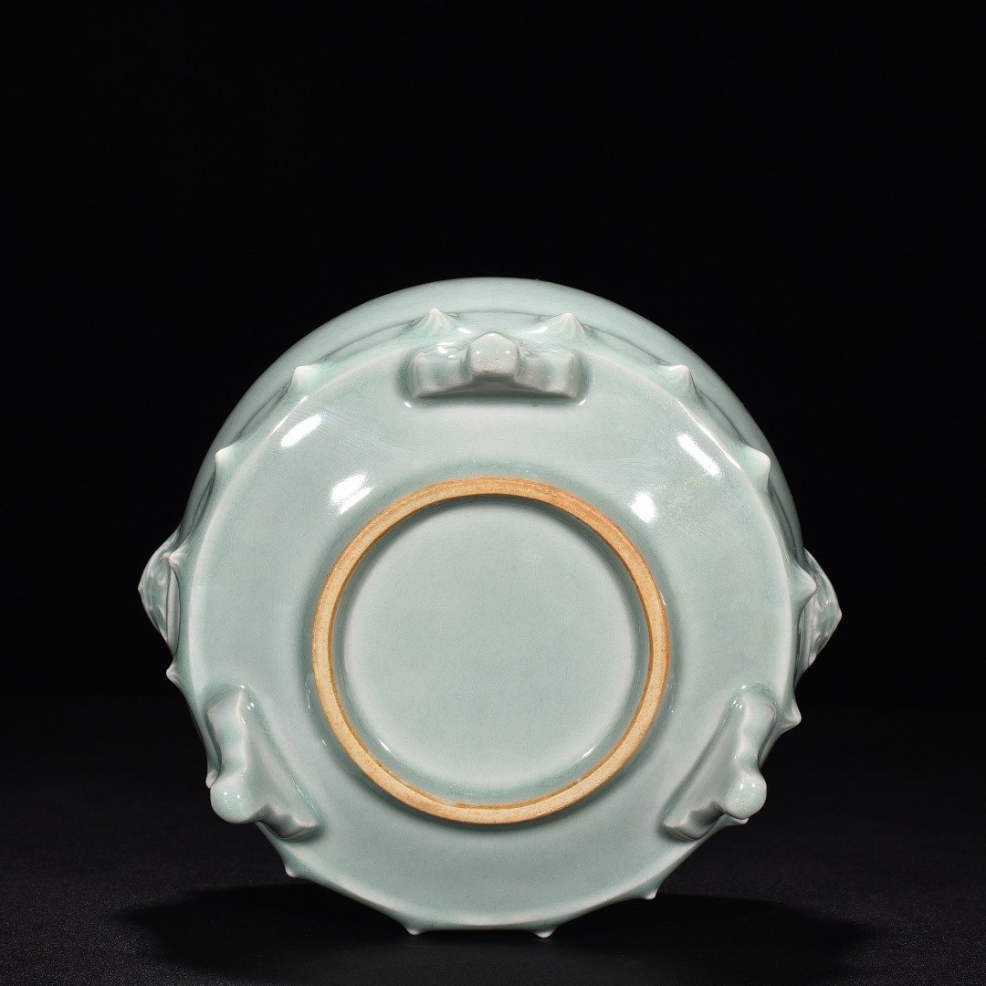 Song Dynasty Longquan kiln pink celadon glaze animal ear drum nail furnace