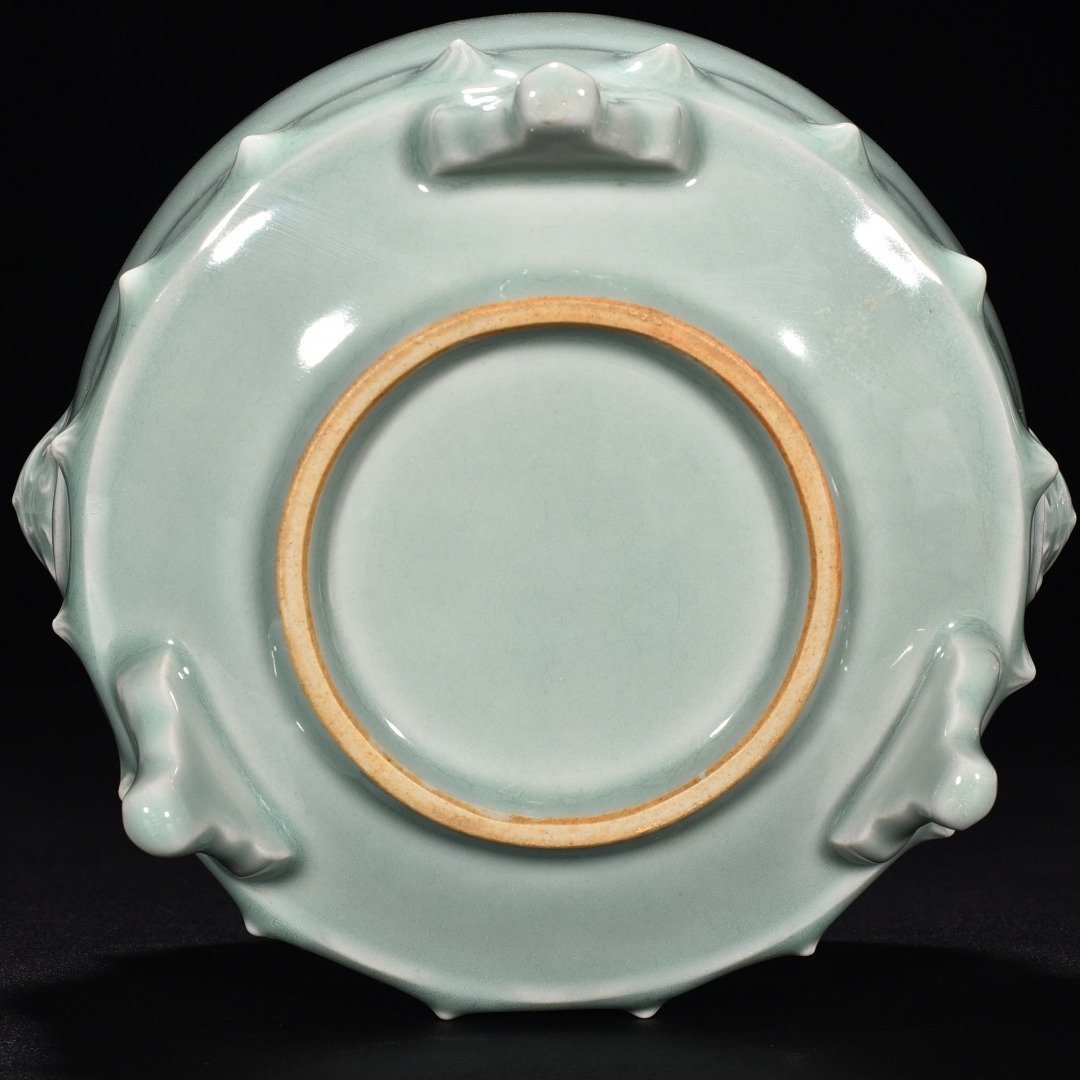 Song Dynasty Longquan kiln pink celadon glaze animal ear drum nail furnace