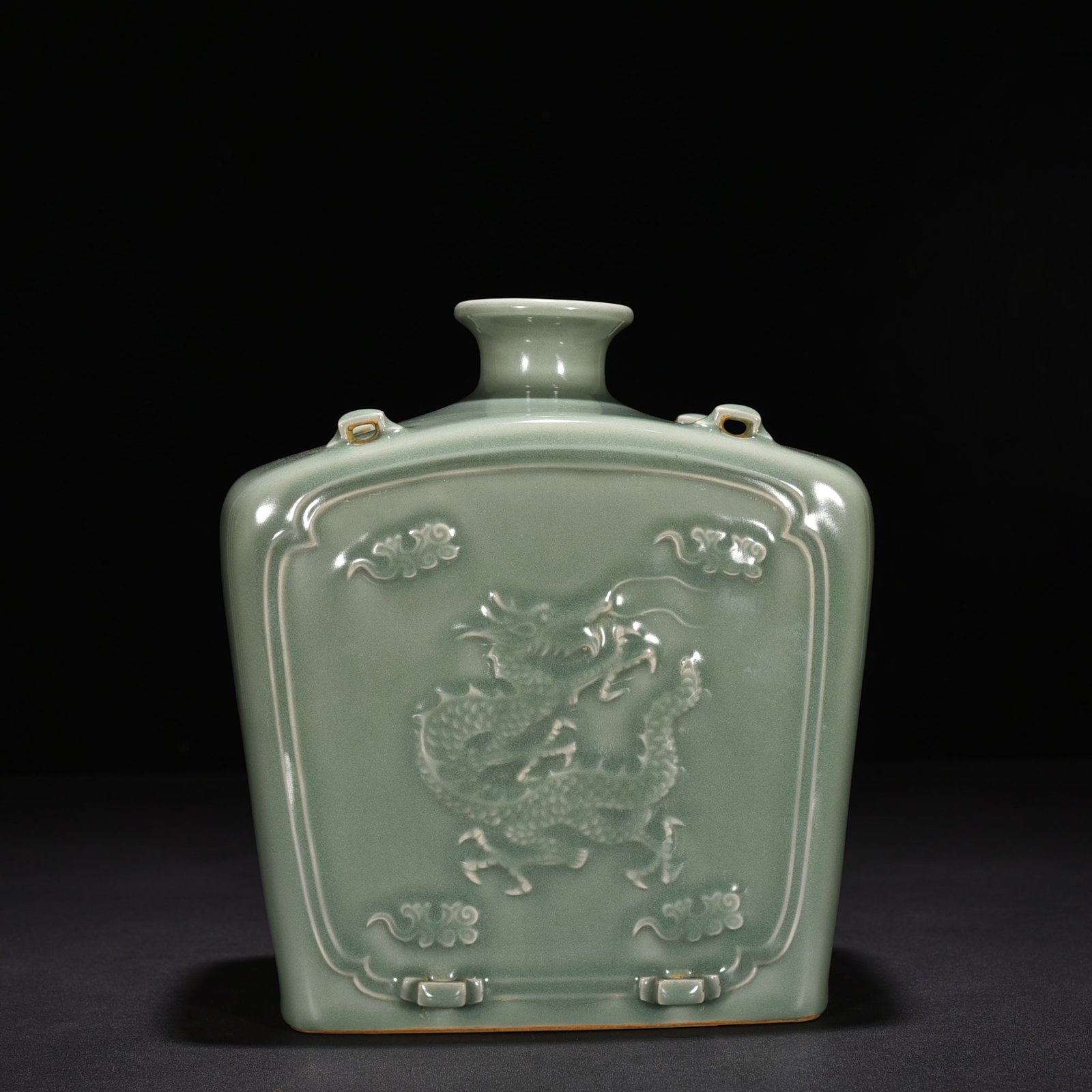 Song Dynasty Longquan kiln pink celadon glaze carved dragon pattern threaded flat bottle