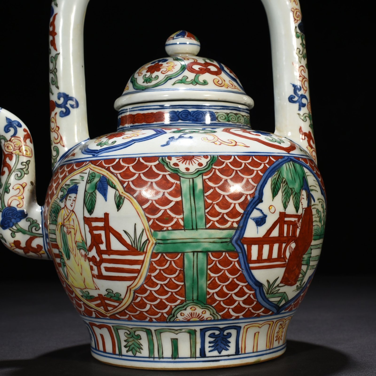 Ming Dynasty Jiajing blue and white multicolored windowed figure pattern handlebar teapot
