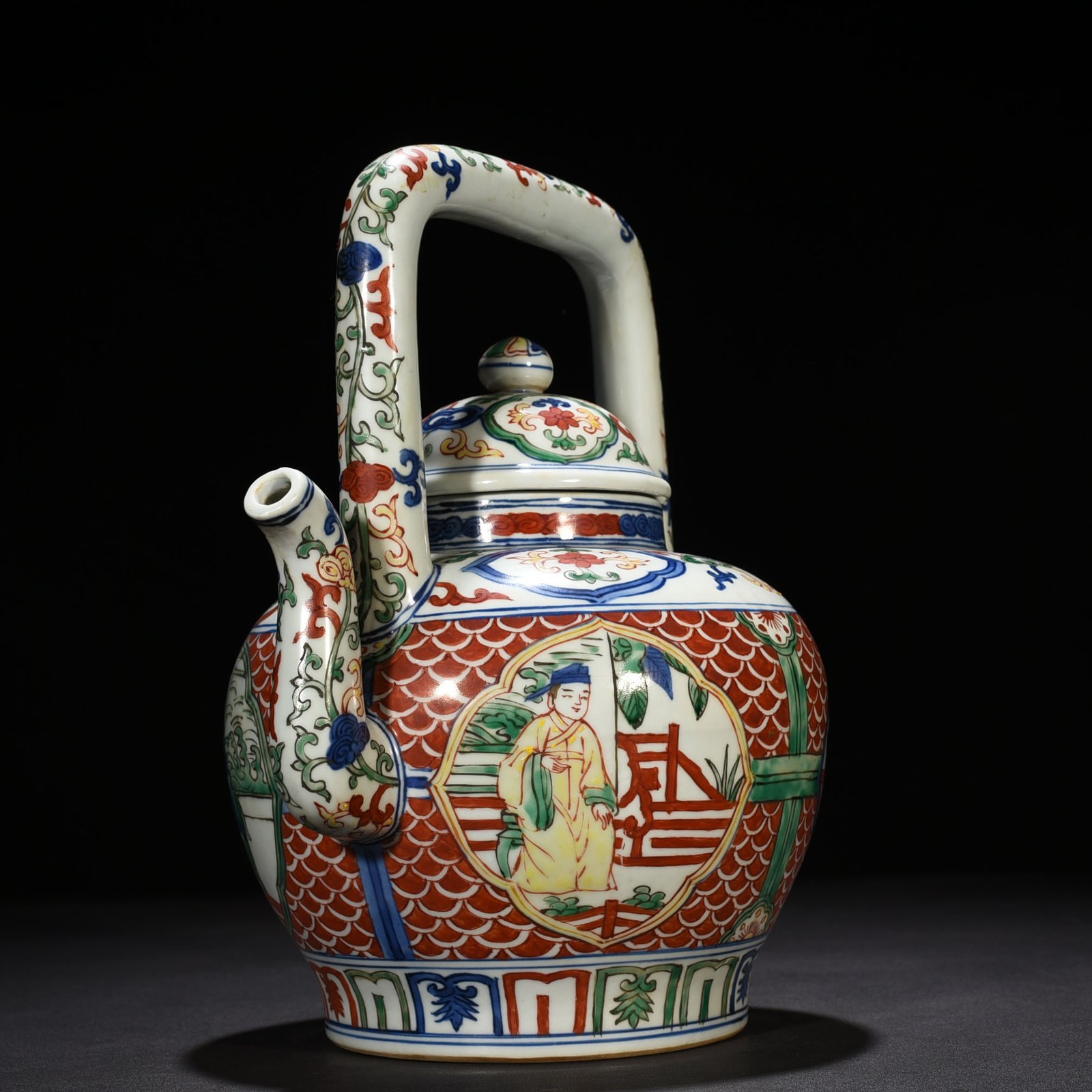 Ming Dynasty Jiajing blue and white multicolored windowed figure pattern handlebar teapot