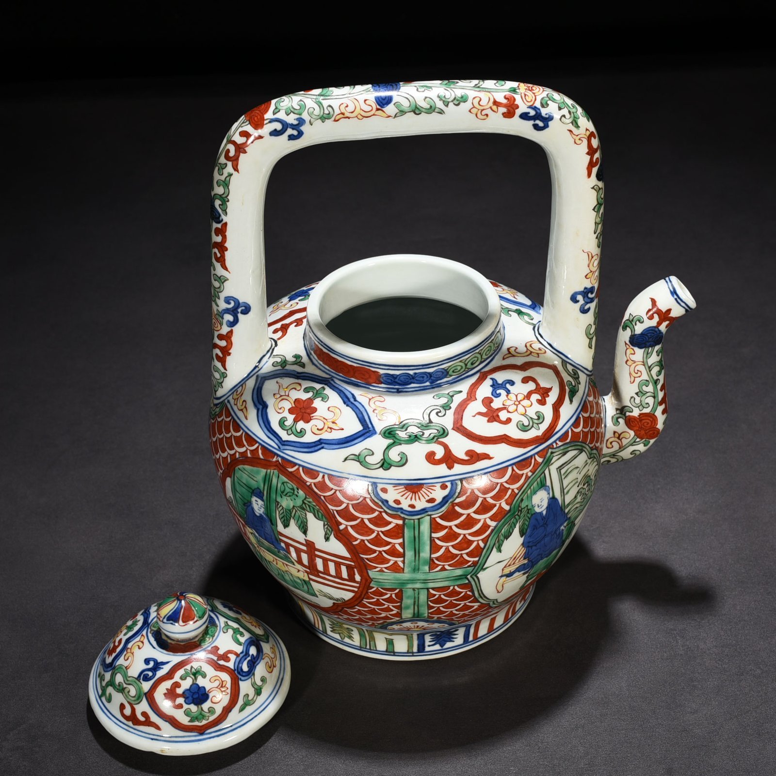 Ming Dynasty Jiajing blue and white multicolored windowed figure pattern handlebar teapot