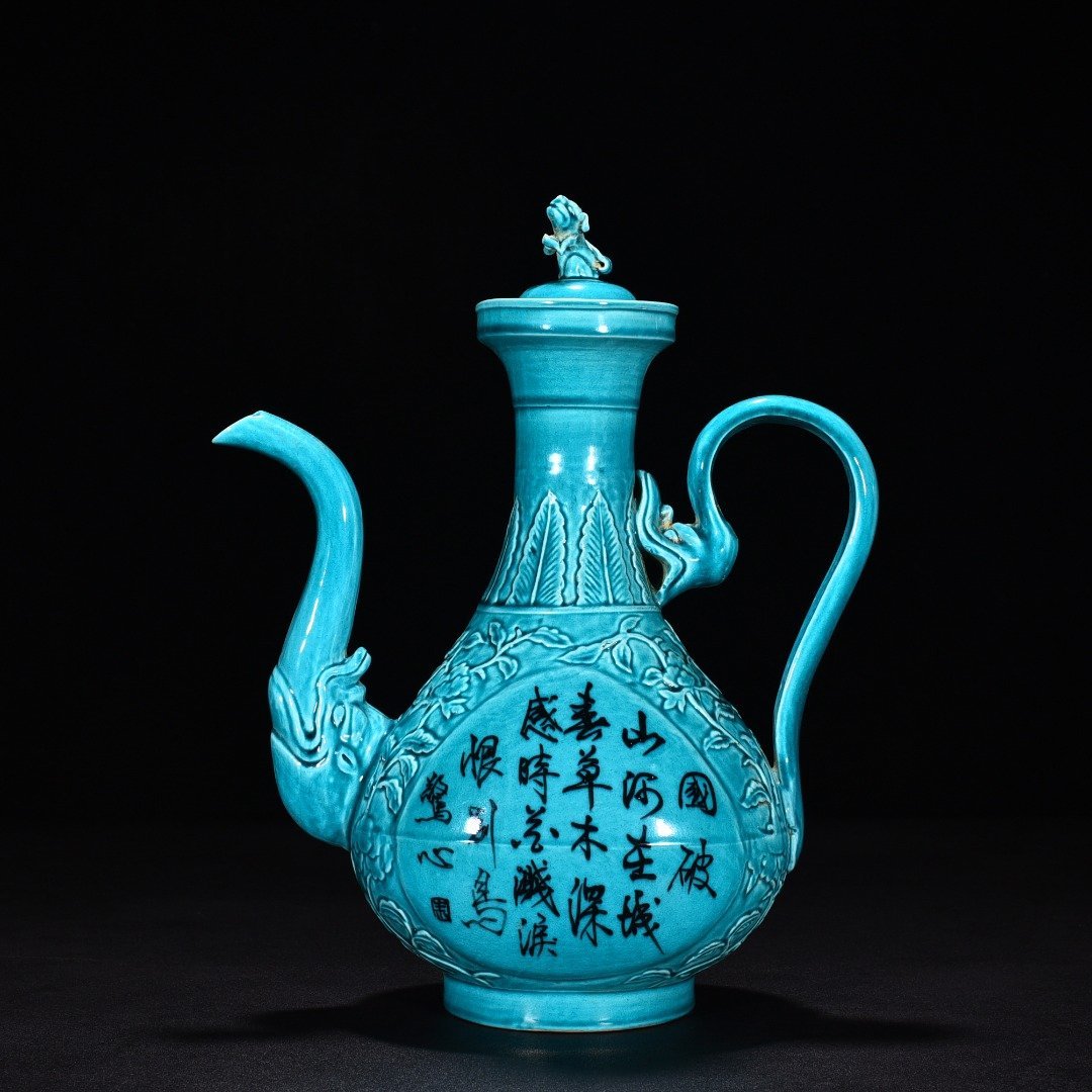 Ming Dynasty Xuande peacock blue glaze engraved flower pattern poem holding pot