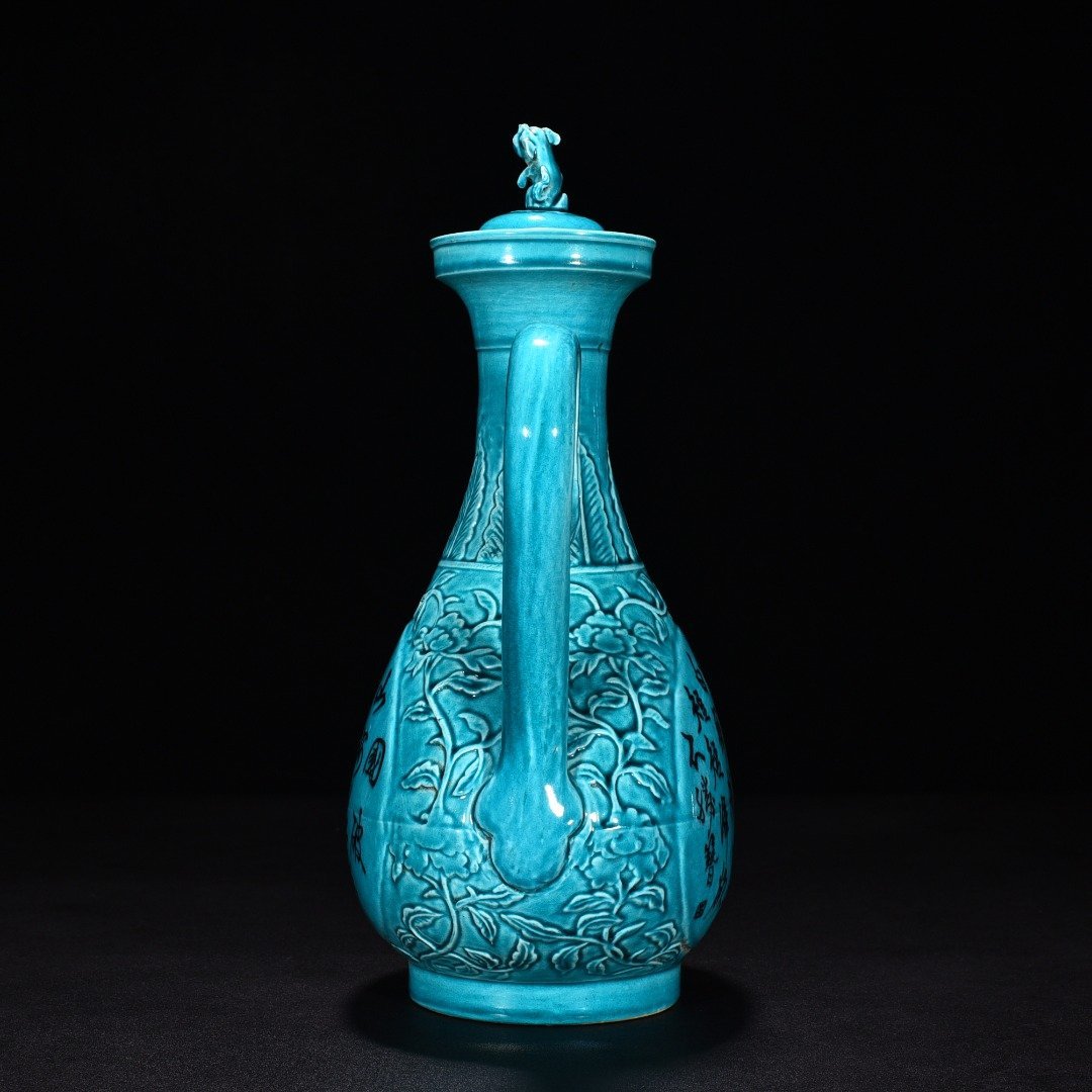 Ming Dynasty Xuande peacock blue glaze engraved flower pattern poem holding pot