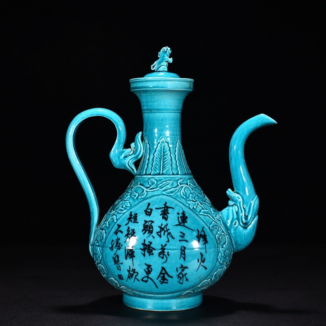 Ming Dynasty Xuande peacock blue glaze engraved flower pattern poem holding pot