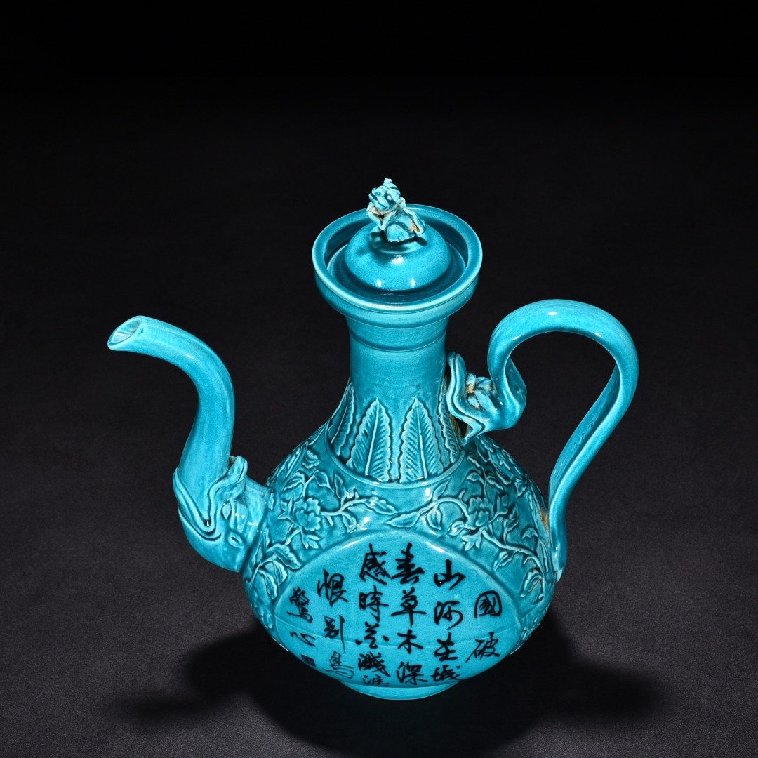 Ming Dynasty Xuande peacock blue glaze engraved flower pattern poem holding pot