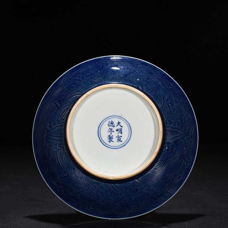 Ming Dynasty Xuande ruby ​​red glaze engraved fish and algae pattern plate
