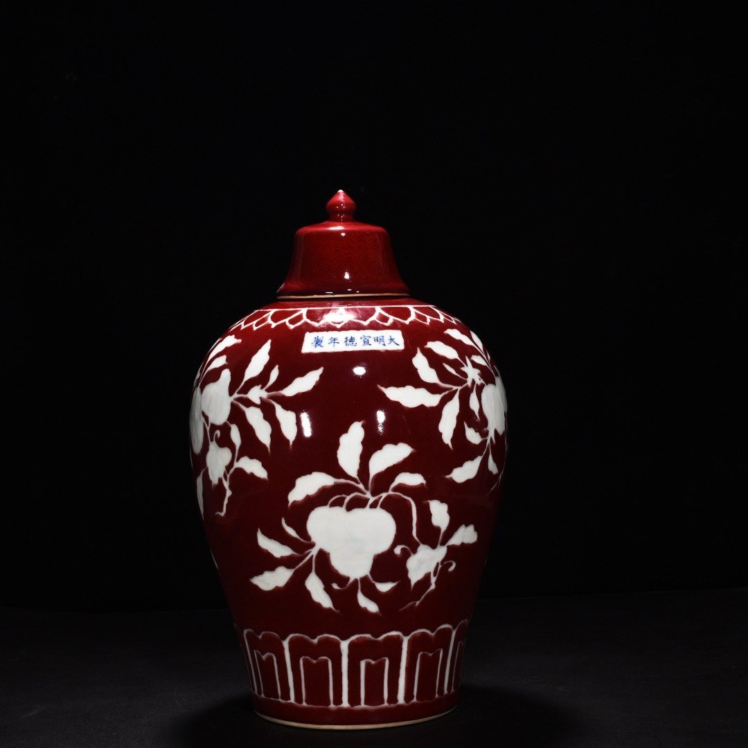Ming Dynasty Xuande gem-glazed white plum vase with engraved branch flower and fruit