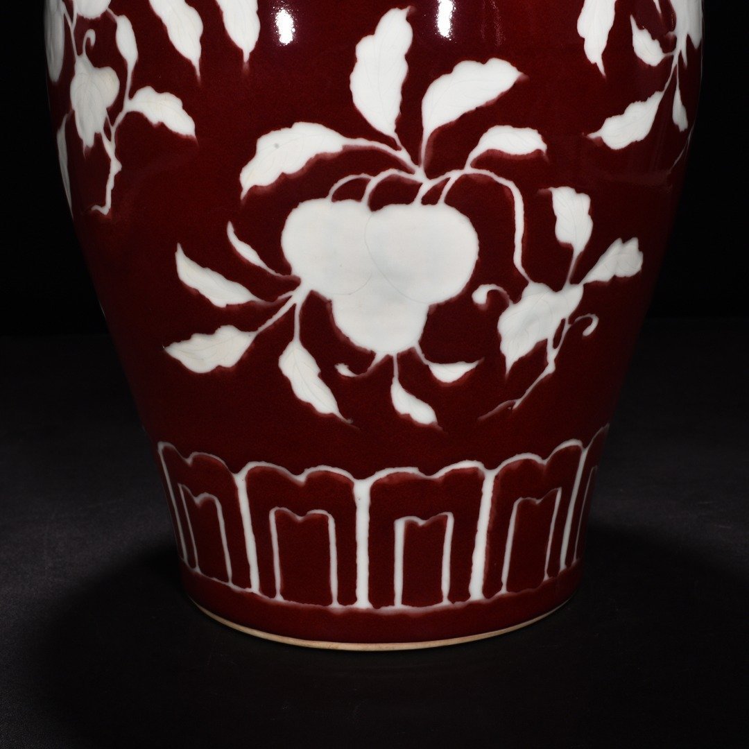 Ming Dynasty Xuande gem-glazed white plum vase with engraved branch flower and fruit