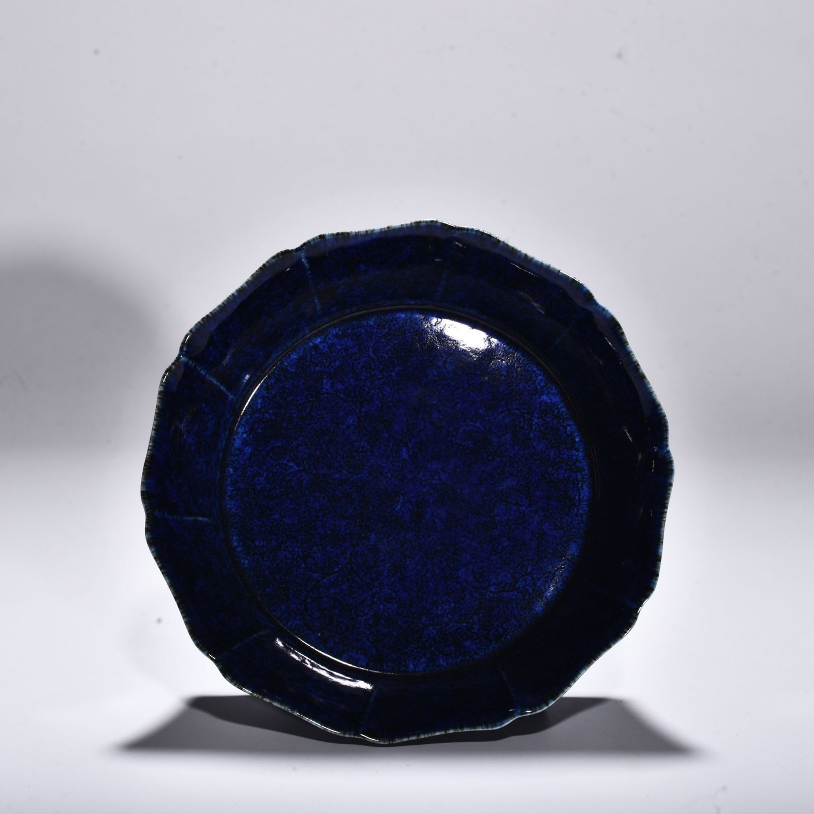 Ming Dynasty Xuande blue glaze engraved with floral pattern and ten-edge wash