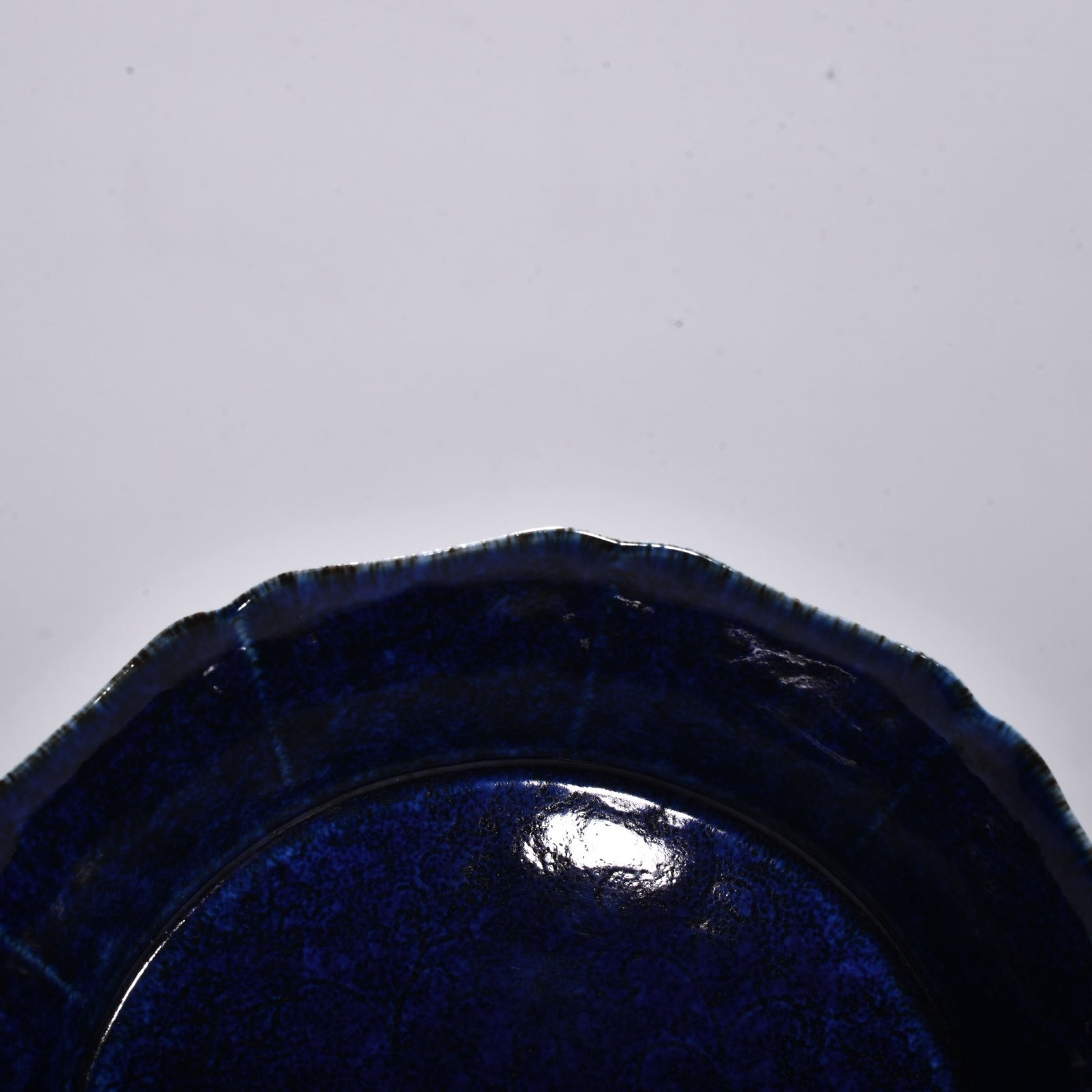 Ming Dynasty Xuande blue glaze engraved with floral pattern and ten-edge wash