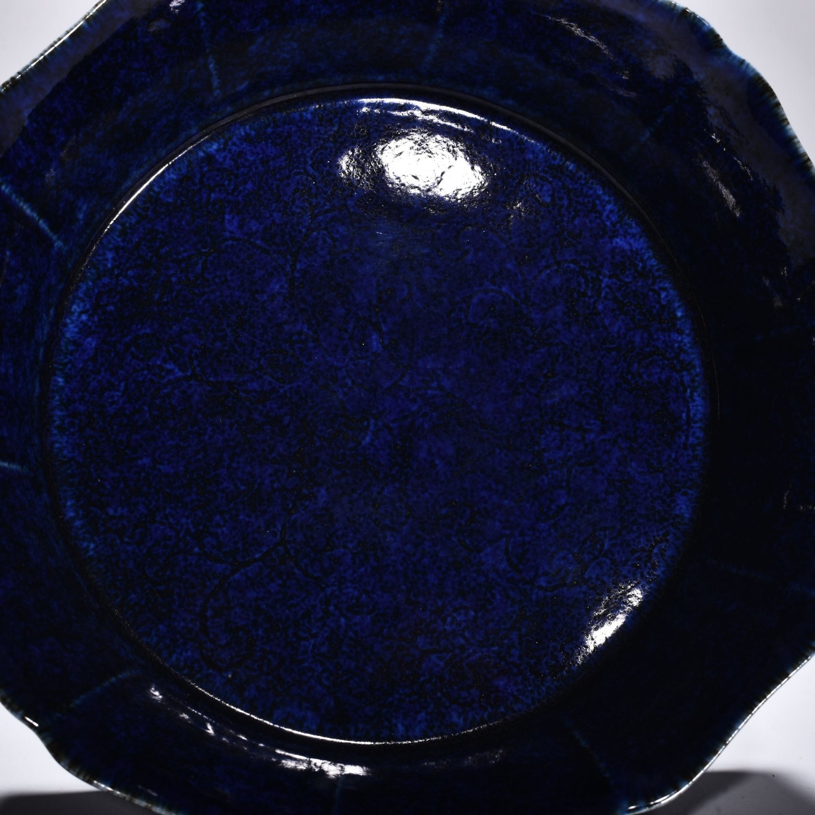 Ming Dynasty Xuande blue glaze engraved with floral pattern and ten-edge wash