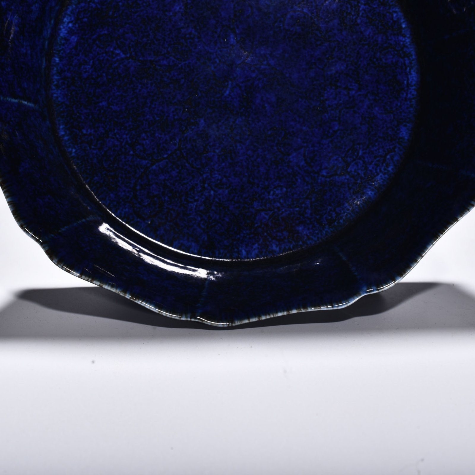 Ming Dynasty Xuande blue glaze engraved with floral pattern and ten-edge wash