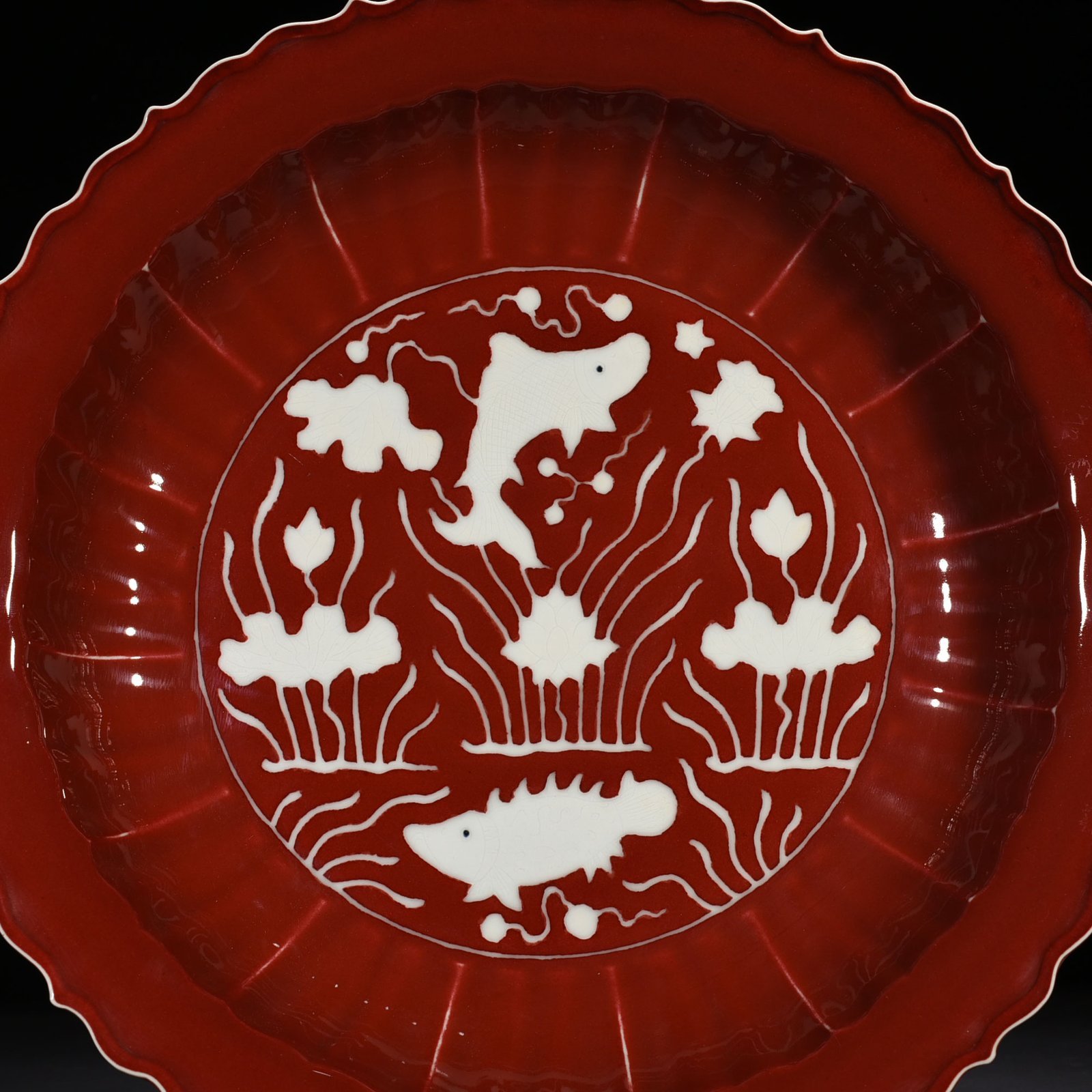 Ming Dynasty Xuande sacrifice red glaze engraved white fish and algae rhombus edge folding plate