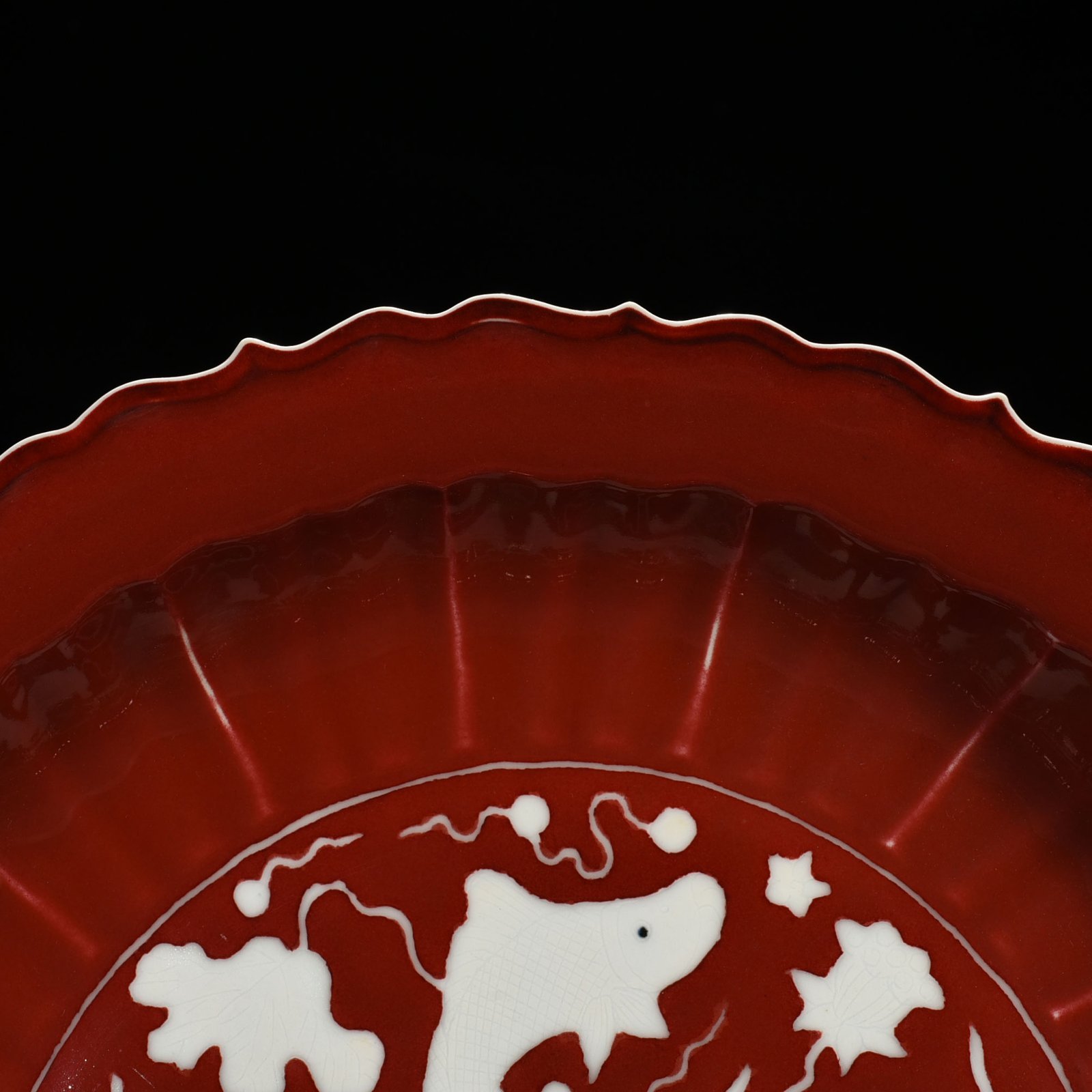Ming Dynasty Xuande sacrifice red glaze engraved white fish and algae rhombus edge folding plate