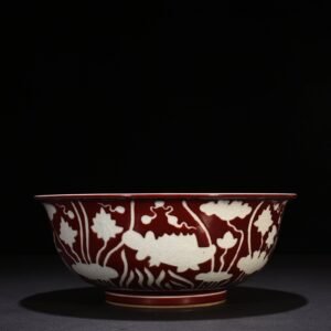 Ming Dynasty Xuande Festival red glaze engraved fish and algae pattern bowl