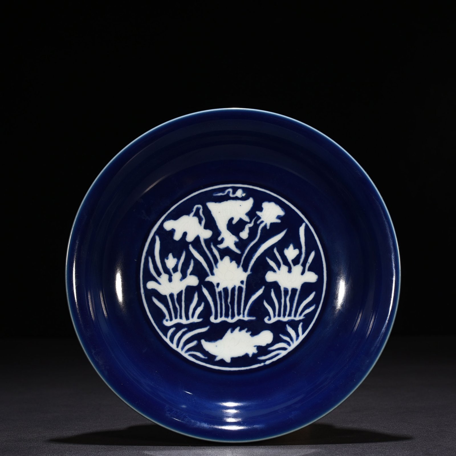 Ming Dynasty Xuande Festival Blue Glaze Carved Fish and Algae Pattern Plate