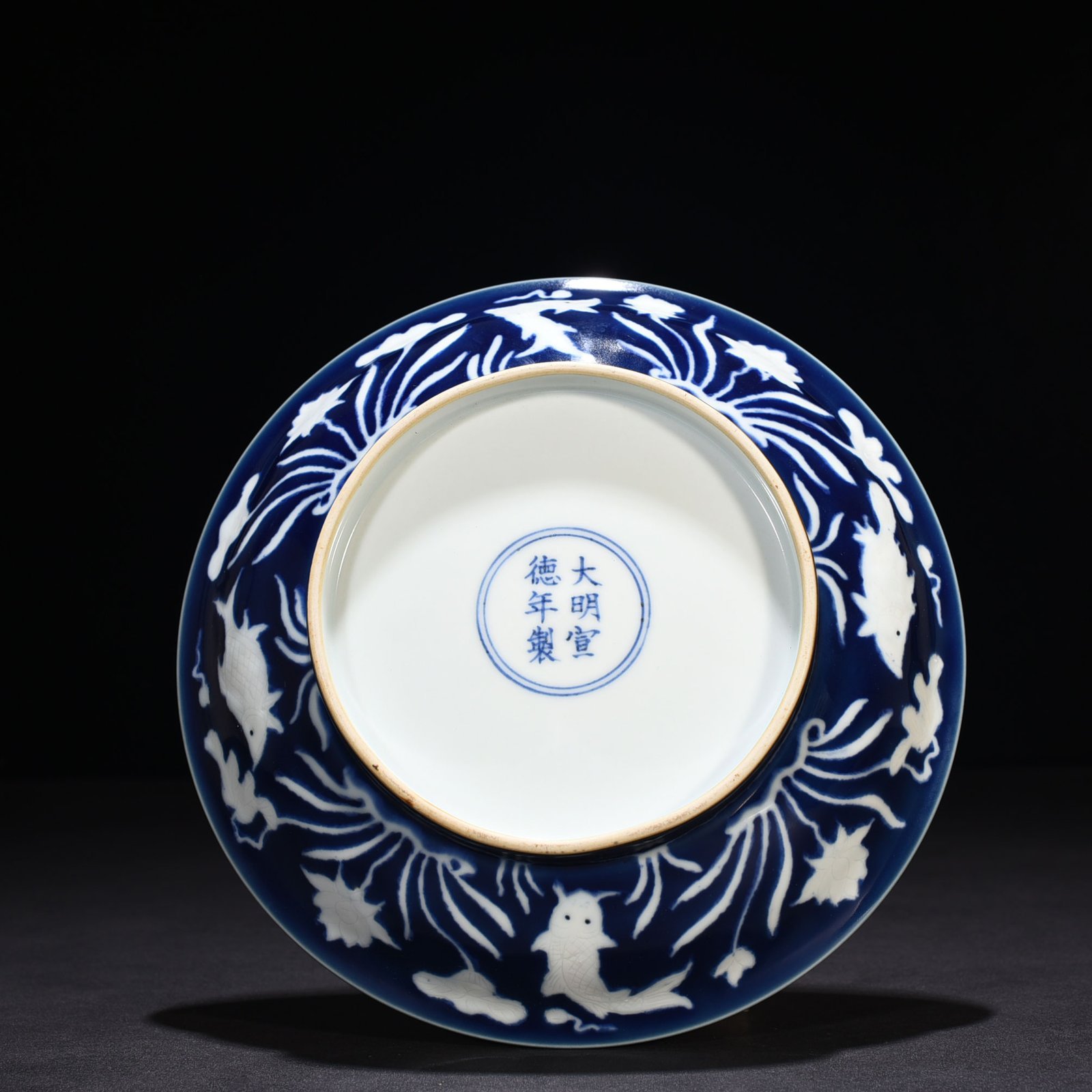 Ming Dynasty Xuande Festival Blue Glaze Carved Fish and Algae Pattern Plate