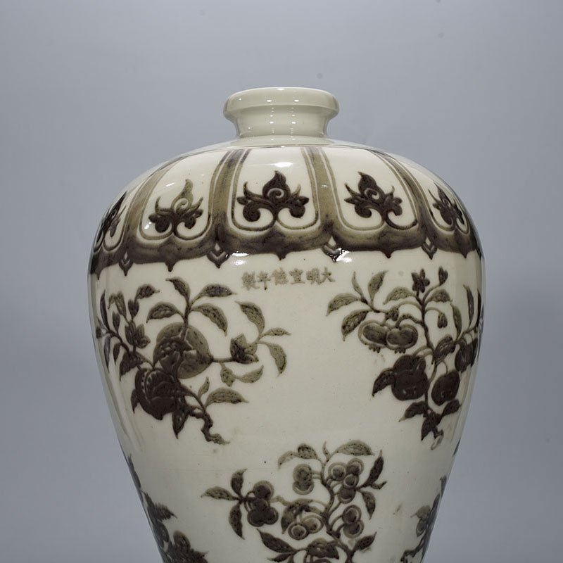Ming Dynasty Xuande underglaze red plum vase with folded branches