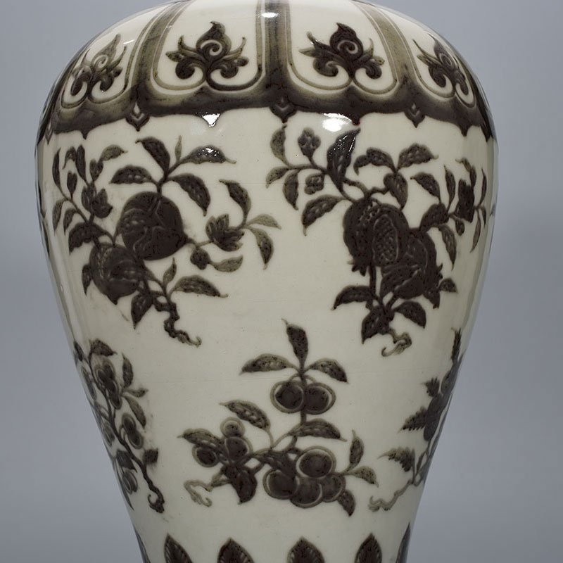 Ming Dynasty Xuande underglaze red plum vase with folded branches