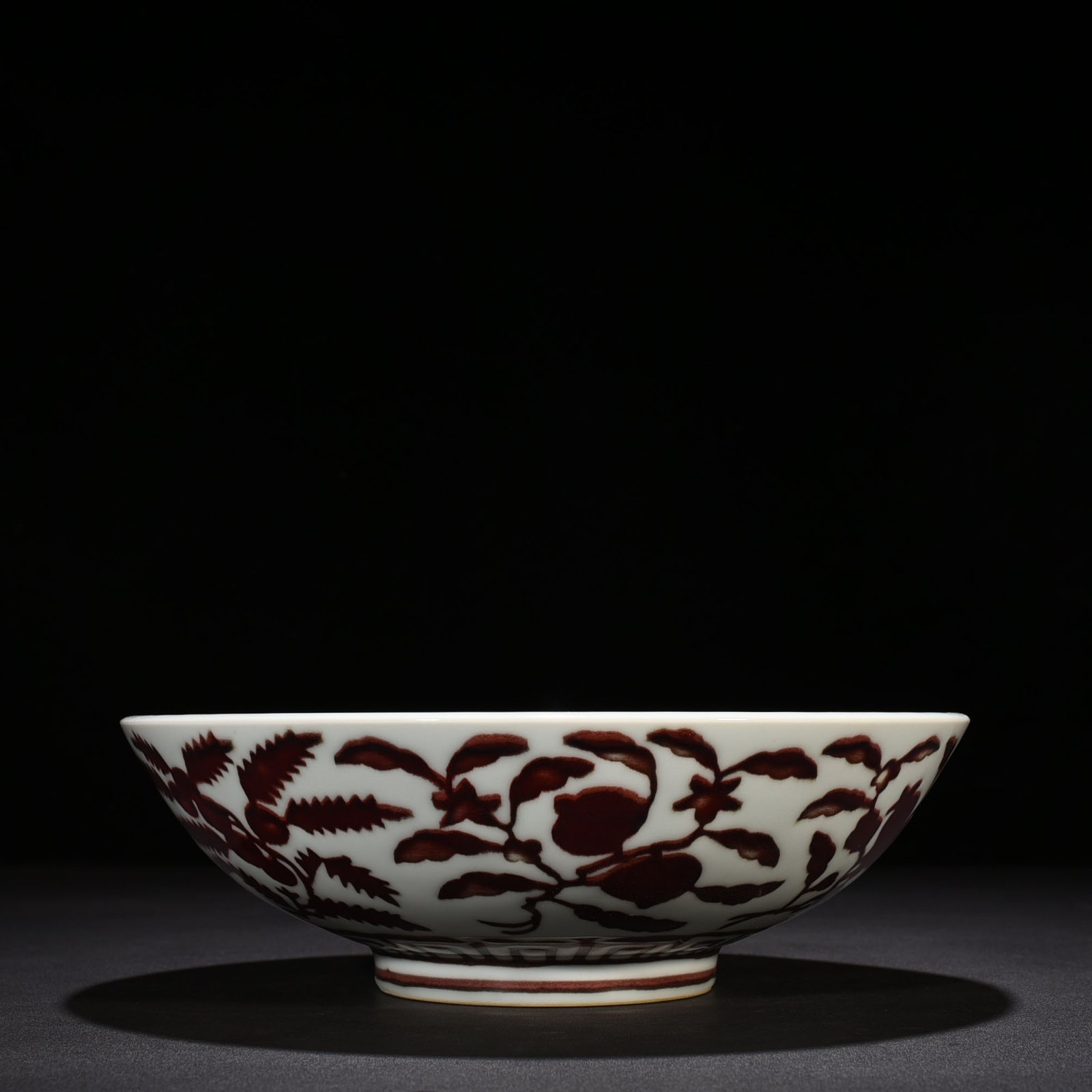 Ming Dynasty Xuande underglaze red dice bowl with folded branches flowers and fruits