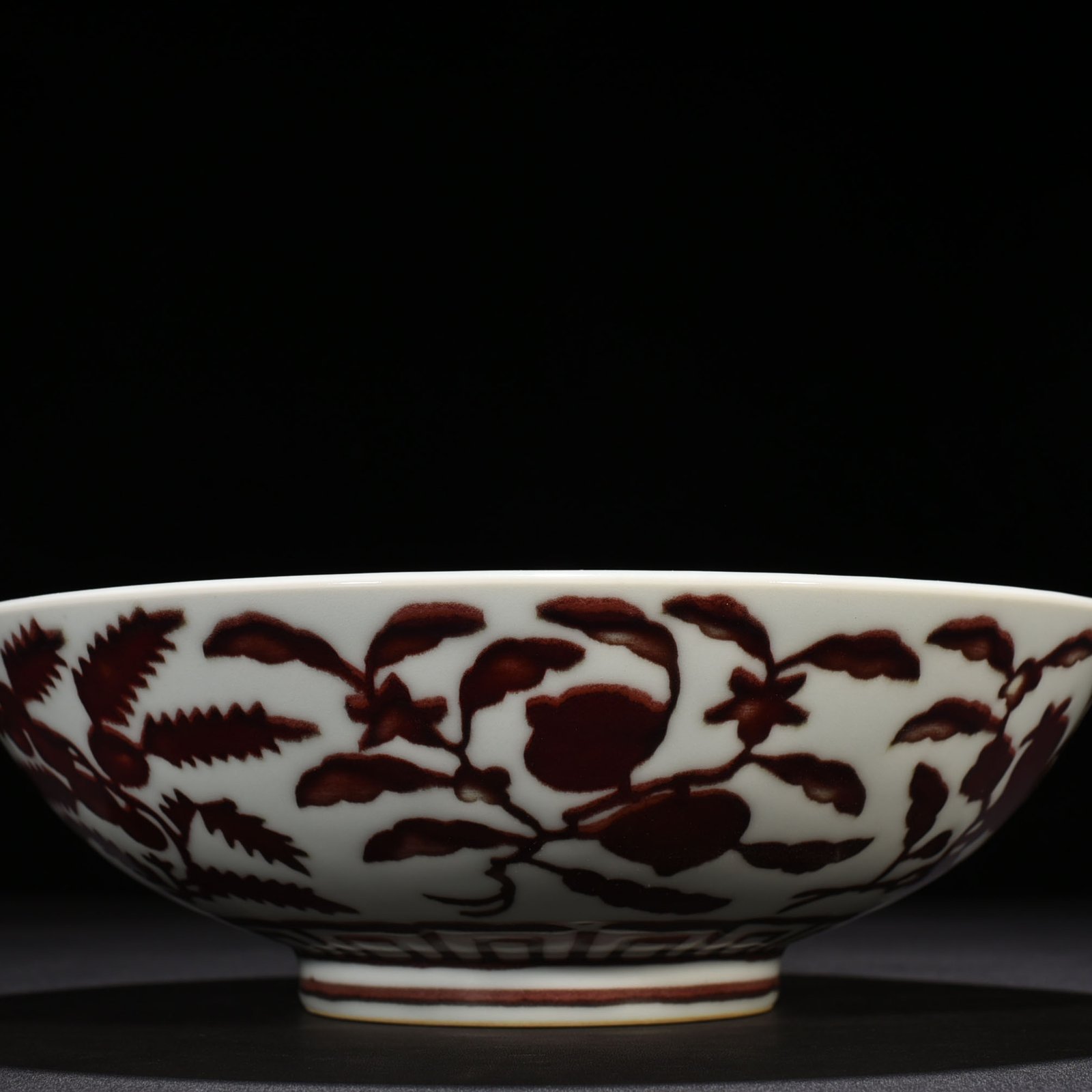 Ming Dynasty Xuande underglaze red dice bowl with folded branches flowers and fruits