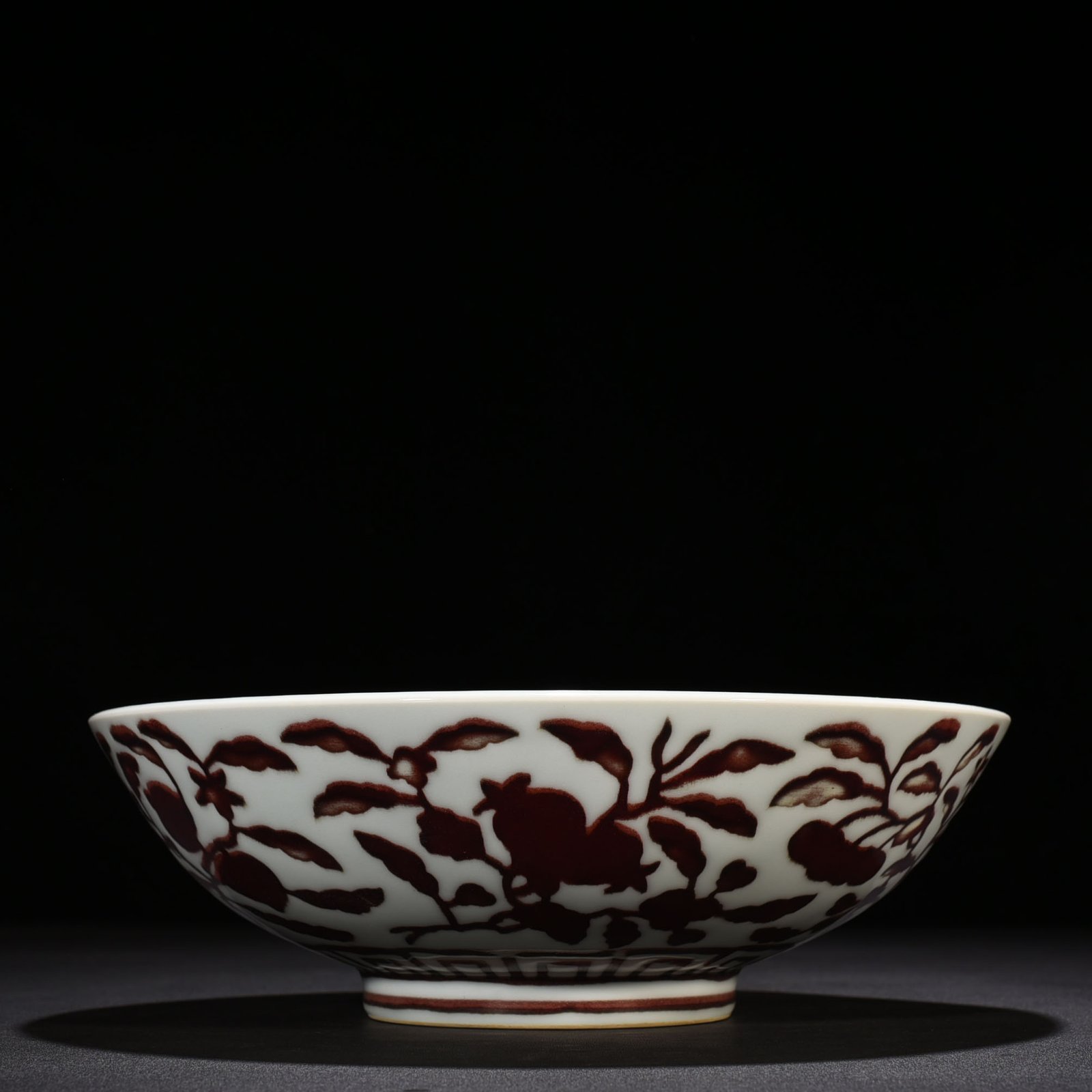 Ming Dynasty Xuande underglaze red dice bowl with folded branches flowers and fruits