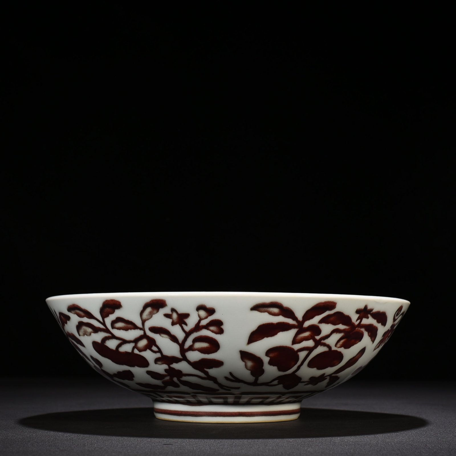 Ming Dynasty Xuande underglaze red dice bowl with folded branches flowers and fruits