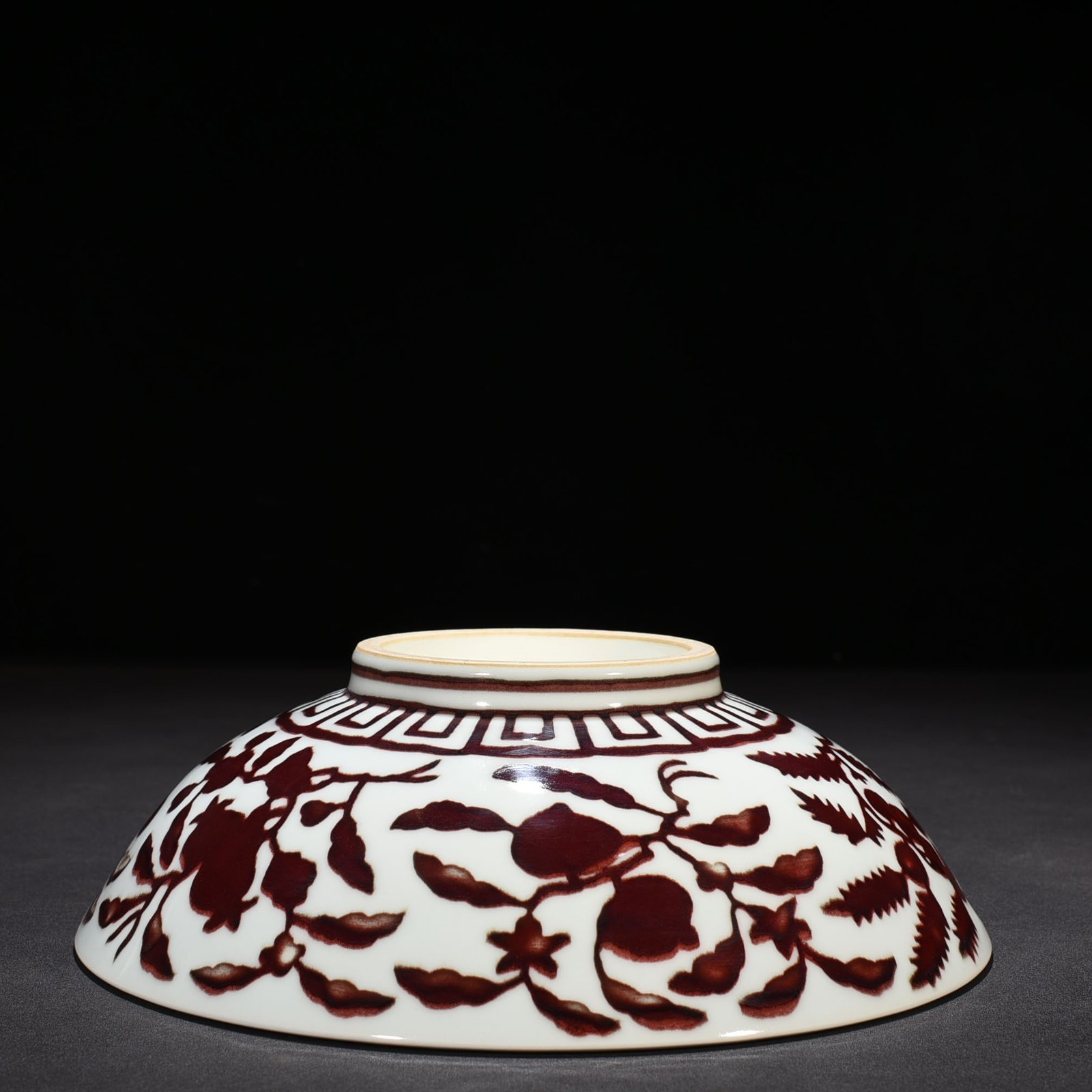 Ming Dynasty Xuande underglaze red dice bowl with folded branches flowers and fruits
