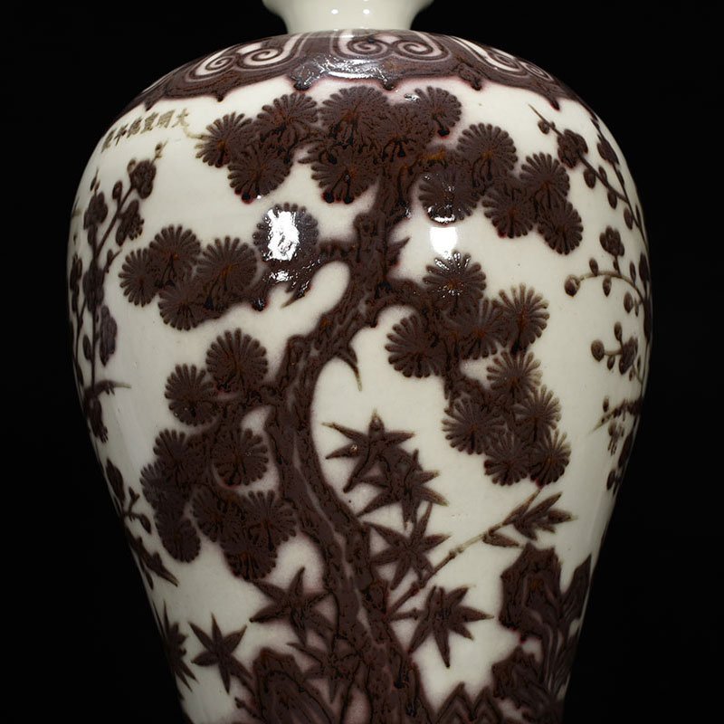 Ming Dynasty Xuande underglaze red pine bamboo and plum vase