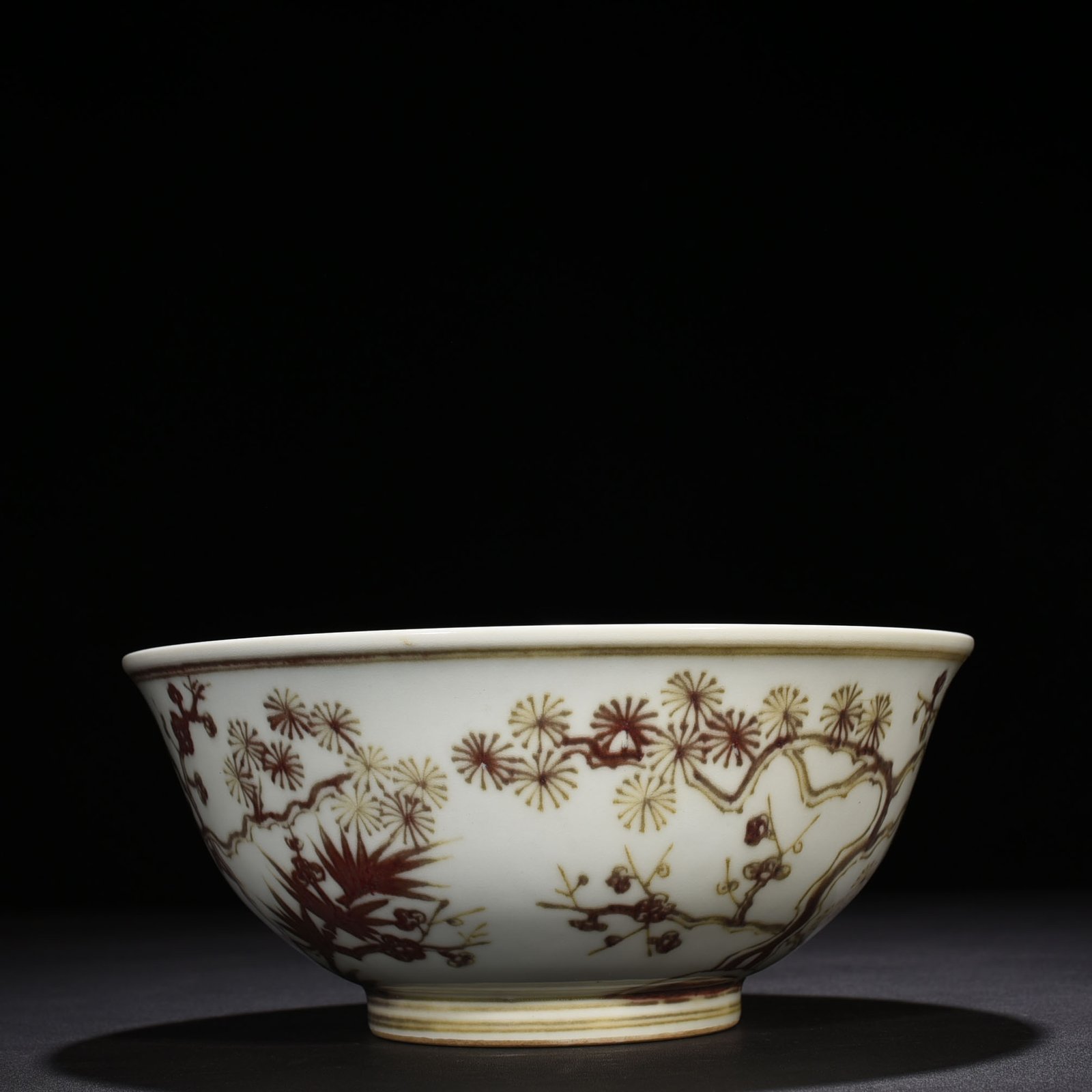 Ming Dynasty Xuande underglaze red pine bamboo and plum pattern bowl