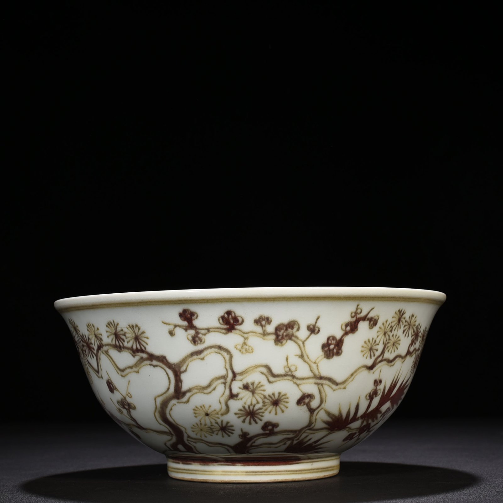 Ming Dynasty Xuande underglaze red pine bamboo and plum pattern bowl