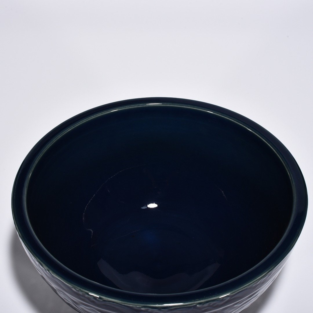 Ming Dynasty Xuande blue glaze bowl with carved cloud and dragon pattern