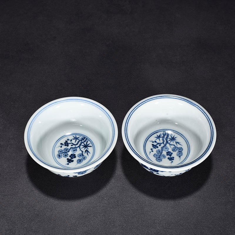 Ming Dynasty Xuande blue and white pine bamboo and plum pattern pressed hand cup