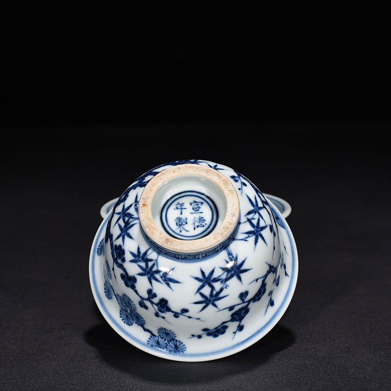 Ming Dynasty Xuande blue and white pine bamboo and plum pattern pressed hand cup