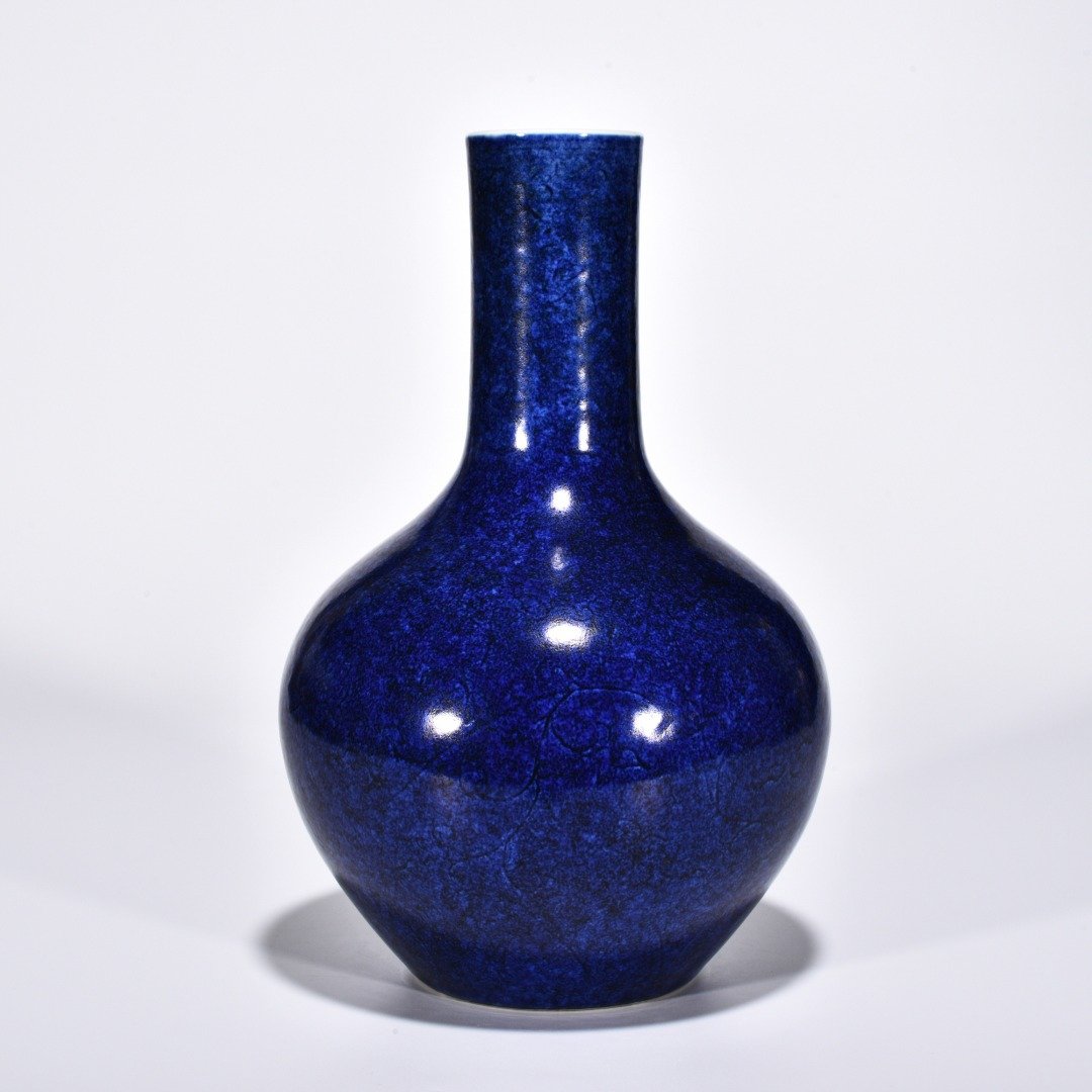 Ming Dynasty Xuande blue-glazed celestial vase with engraved flower pattern