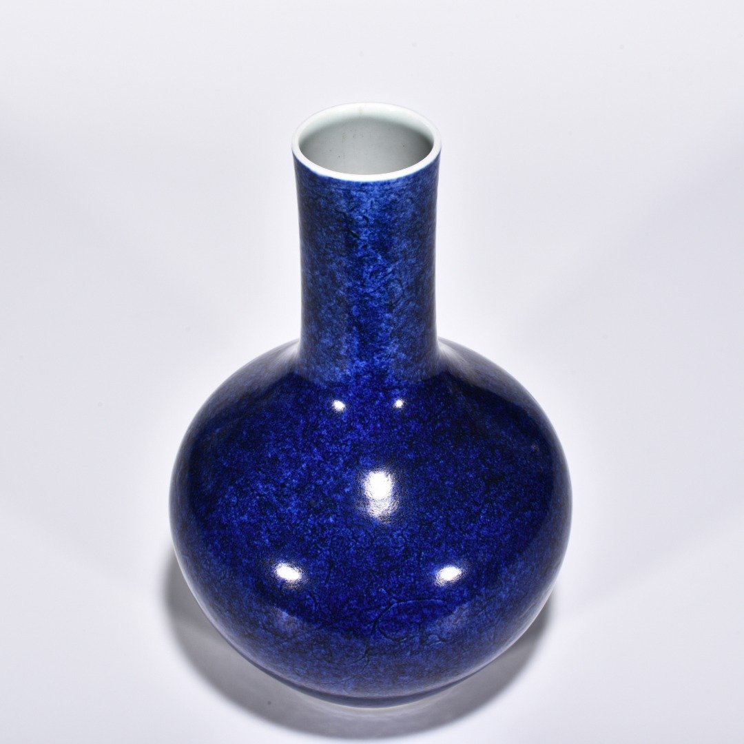 Ming Dynasty Xuande blue-glazed celestial vase with engraved flower pattern