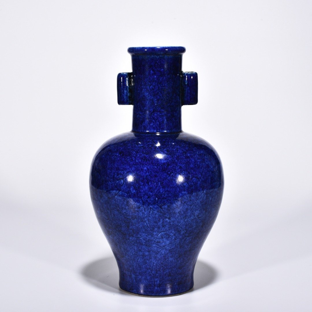 Ming Dynasty Xuande blue and white glaze engraved flower pattern through-ear vase