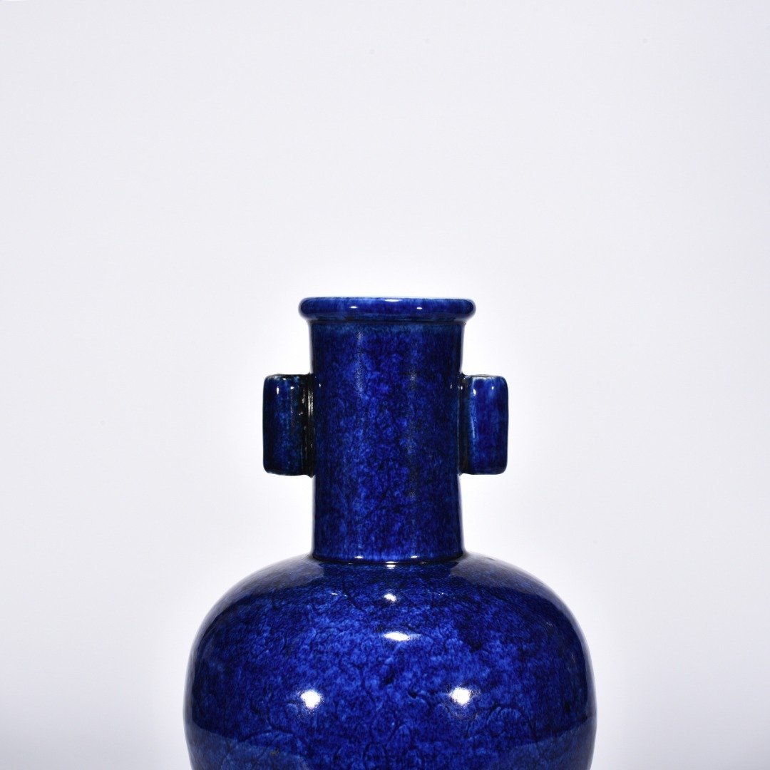 Ming Dynasty Xuande blue and white glaze engraved flower pattern through-ear vase