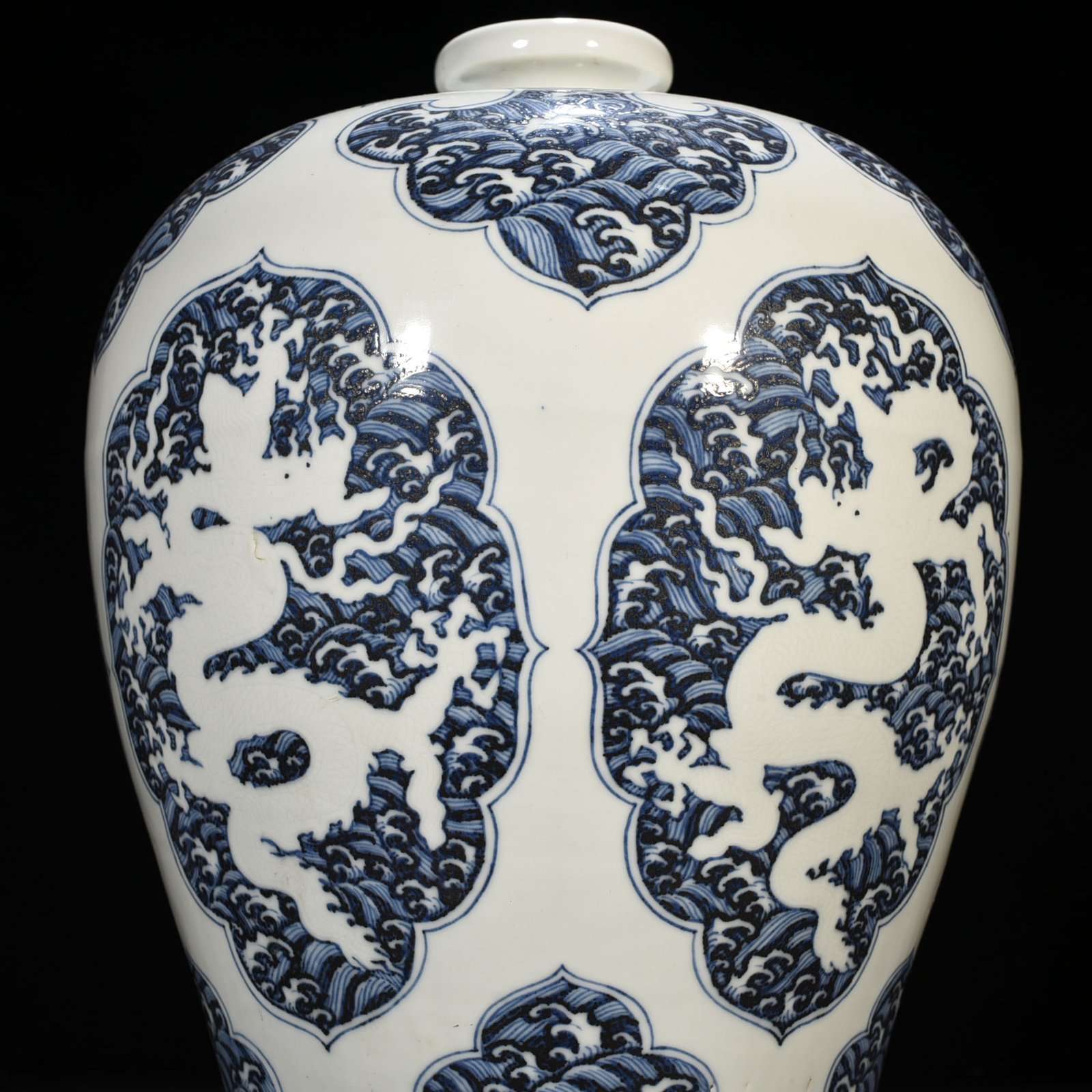 Ming Dynasty Xuande blue and white sea water carved white dragon plum vase