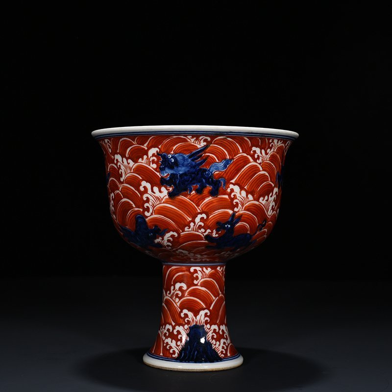 Ming Dynasty Xuande blue and white alum red sea eight monster pattern goblet