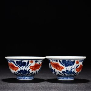 Ming Dynasty Xuande blue and white alum red fish and algae pattern pressed hand cup