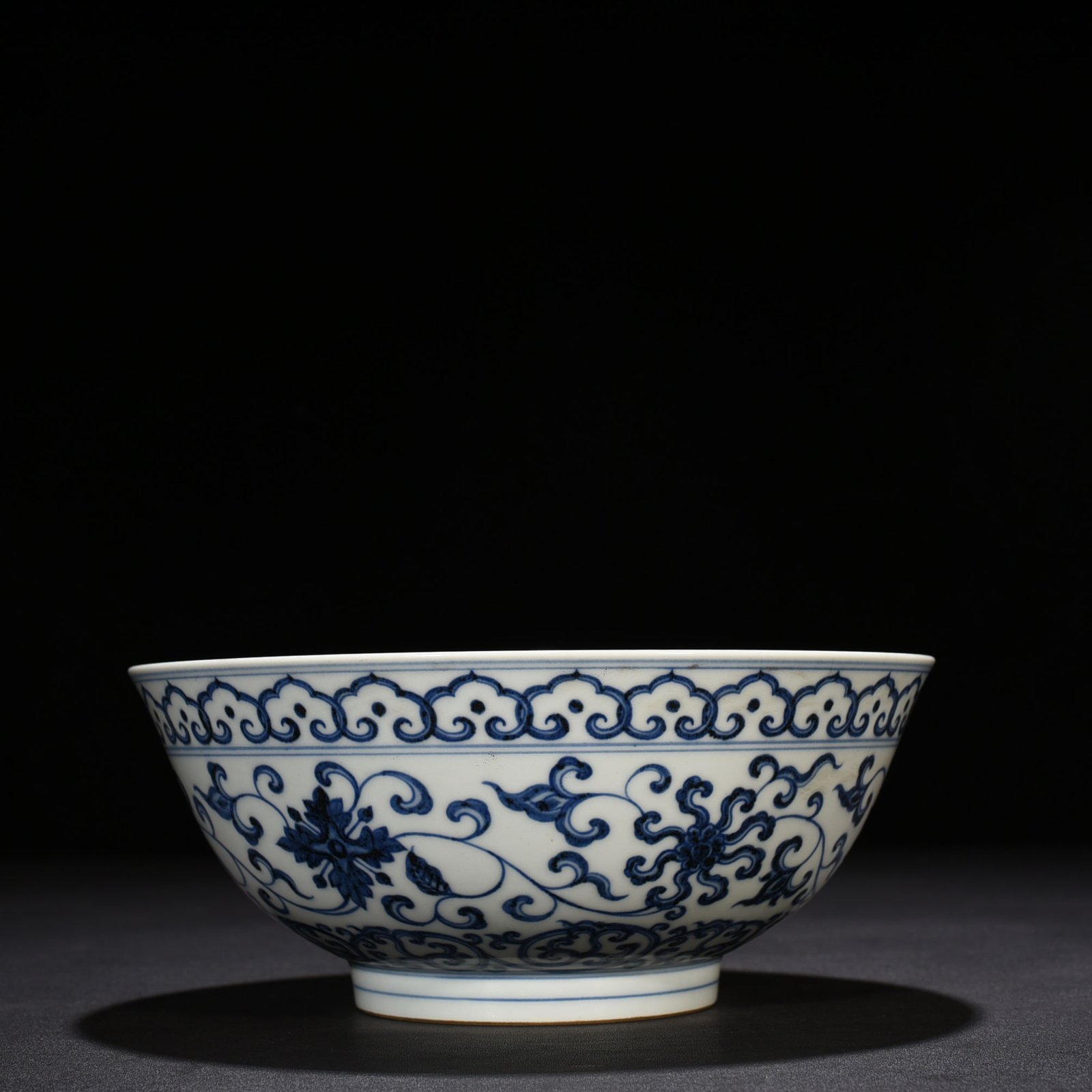 Ming Dynasty Xuande blue and white lotus bowl with Sanskrit holder